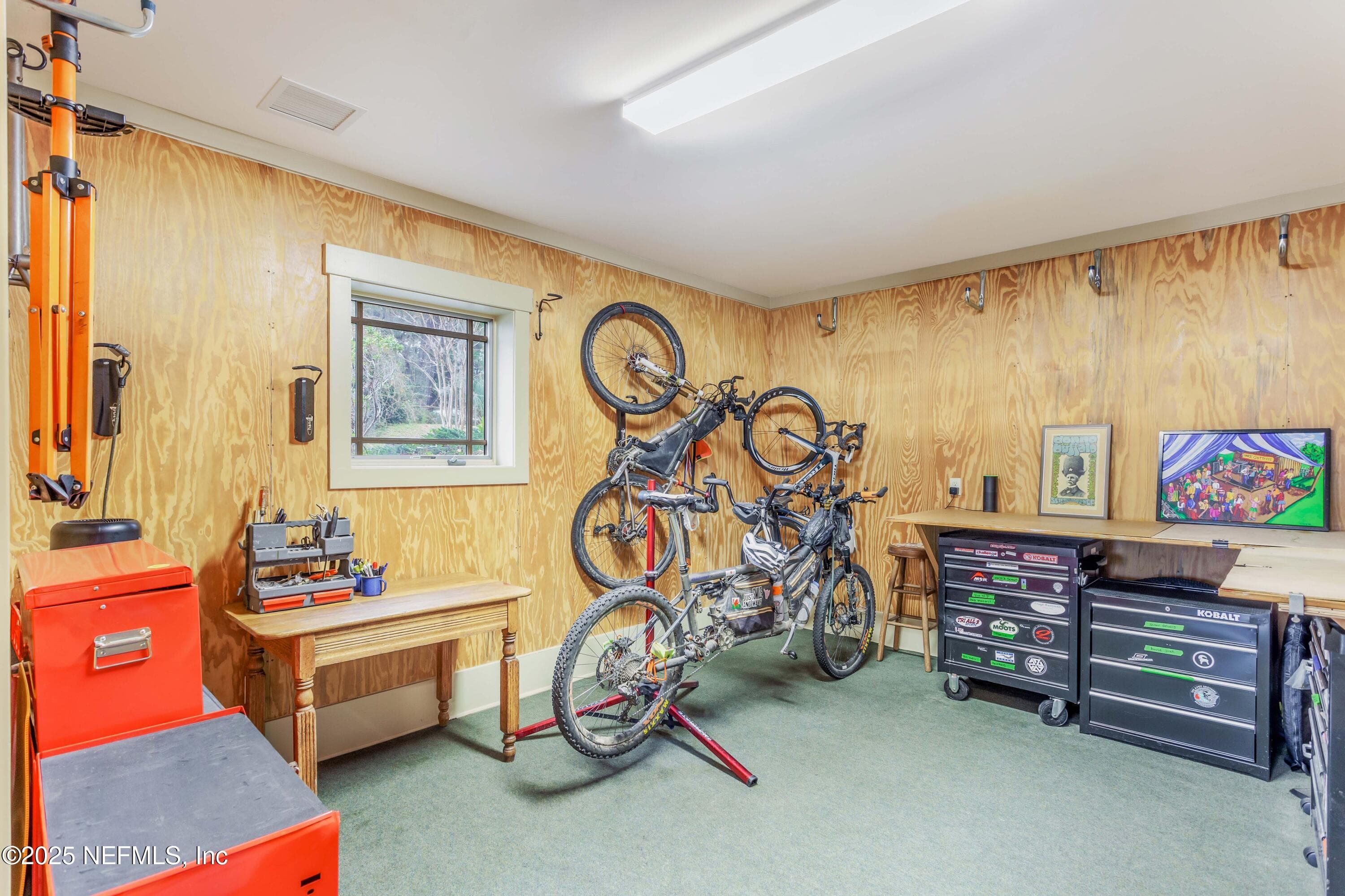 Bike shop, work room. Porcelain tile beneath carpet. — 940564 OLD NASSAUVILLE Road, Fernandina Beach, FL 32034