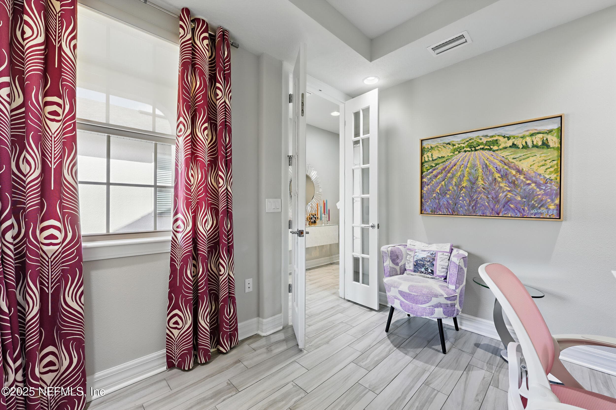 Den/office (alternate angle) — Den with French glass door, wood-look tile flooring, window with roller shade, and recessed ceiling light. Room provides a private workspace off the main living area. — 92 CANOPY OAK Lane, Ponte Vedra, FL 32081