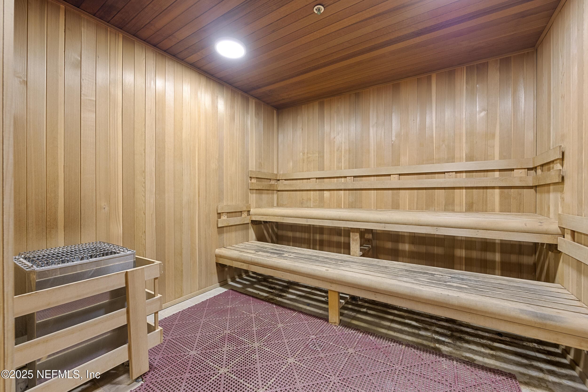 Anastasia Clubhouse sauna — Cedar-lined dry sauna with tiered bench seating and electric heater inside the Anastasia Clubhouse spa area at Del Webb Ponte Vedra. — 92 CANOPY OAK Lane, Ponte Vedra, FL 32081