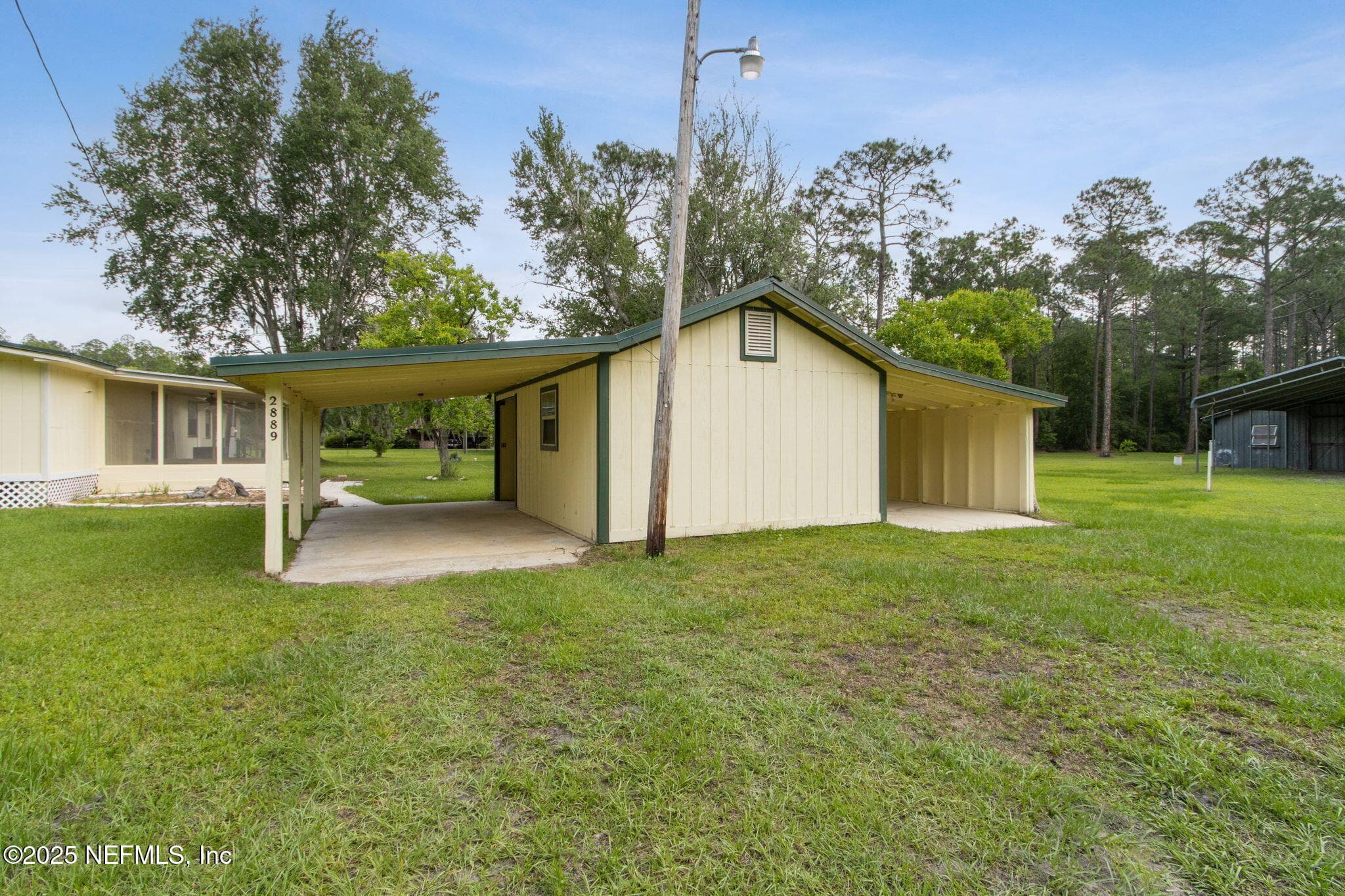 car port with utility room — 2889 SANTA FE Trail, Hilliard, FL 32046