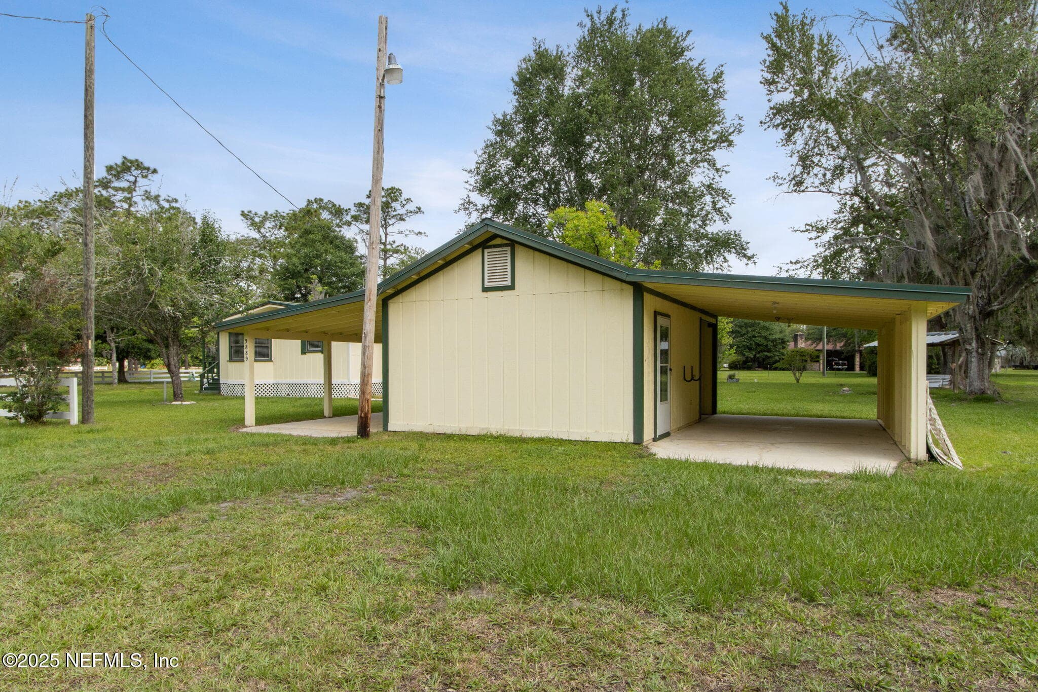 car port with utility room — 2889 SANTA FE Trail, Hilliard, FL 32046