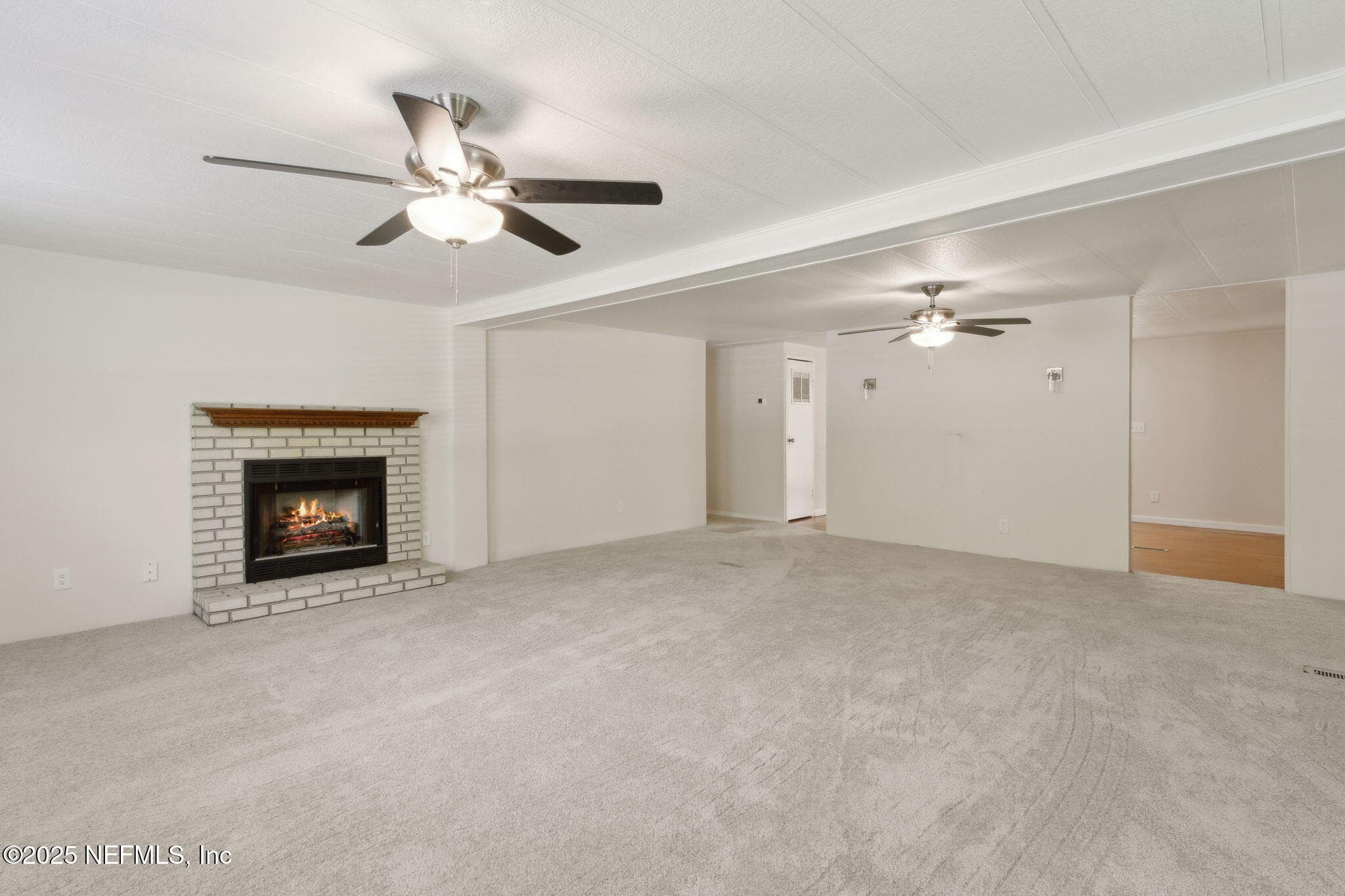 living area with fireplace — 2889 SANTA FE Trail, Hilliard, FL 32046