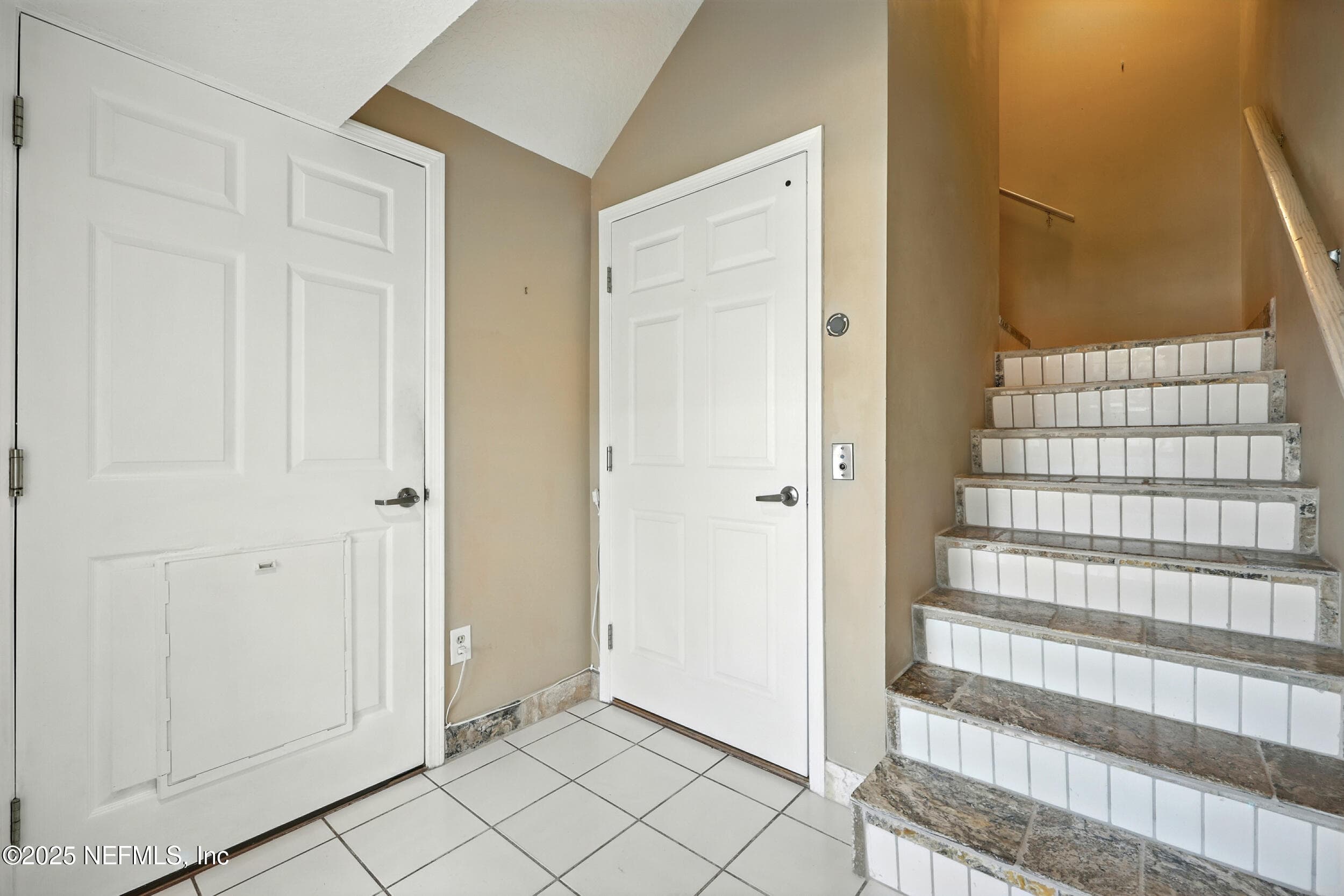 Stairway leading to upper floors with elevator right next to the stairs — 3331 LIGHTHOUSE POINT Lane, Jacksonville, FL 32250