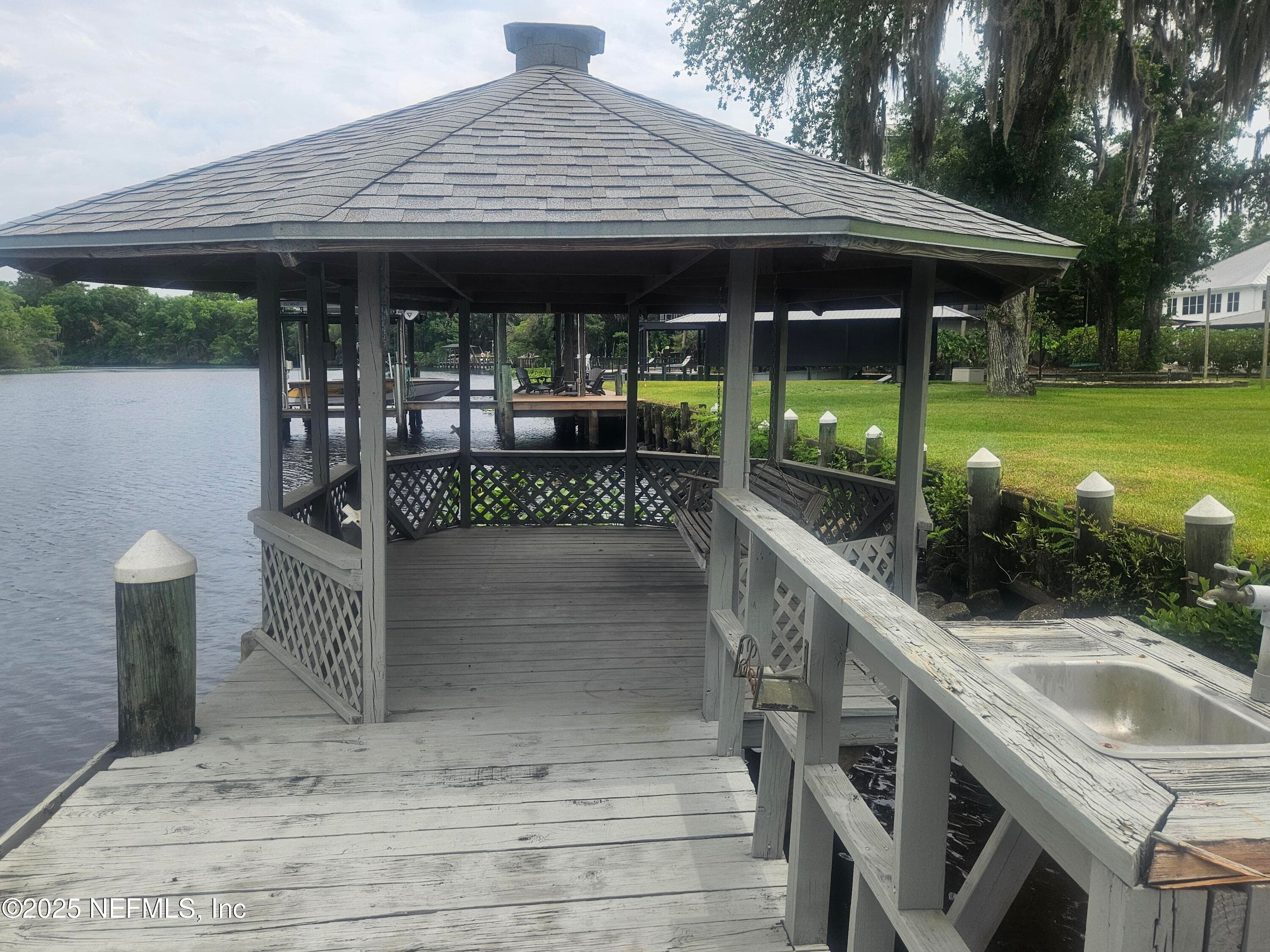 Gazabo with power, Ceiling fan, water with fish clean station — 435 LAKE ASBURY Drive, Green Cove Springs, FL 32043