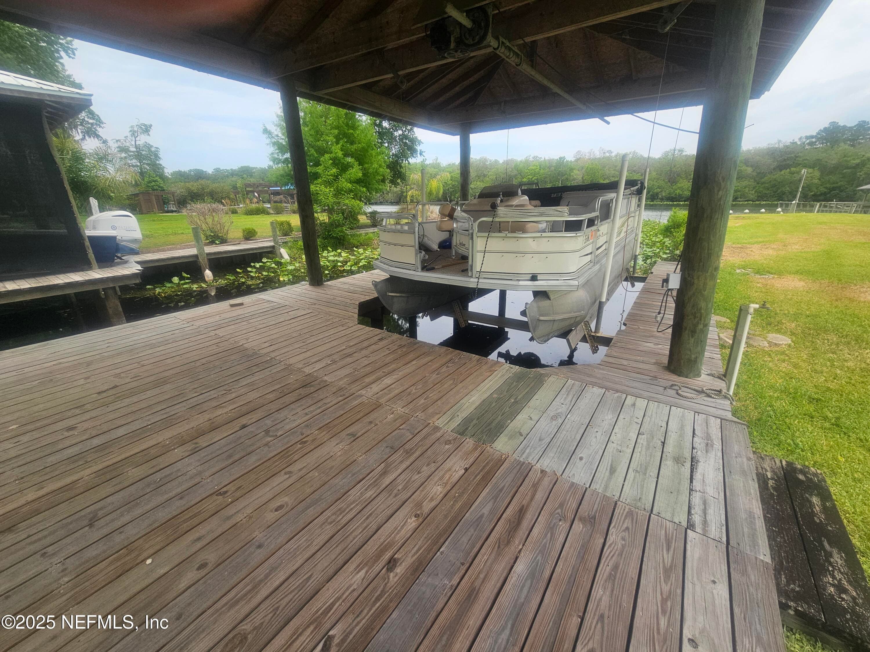 Boat house with electric lift — 435 LAKE ASBURY Drive, Green Cove Springs, FL 32043