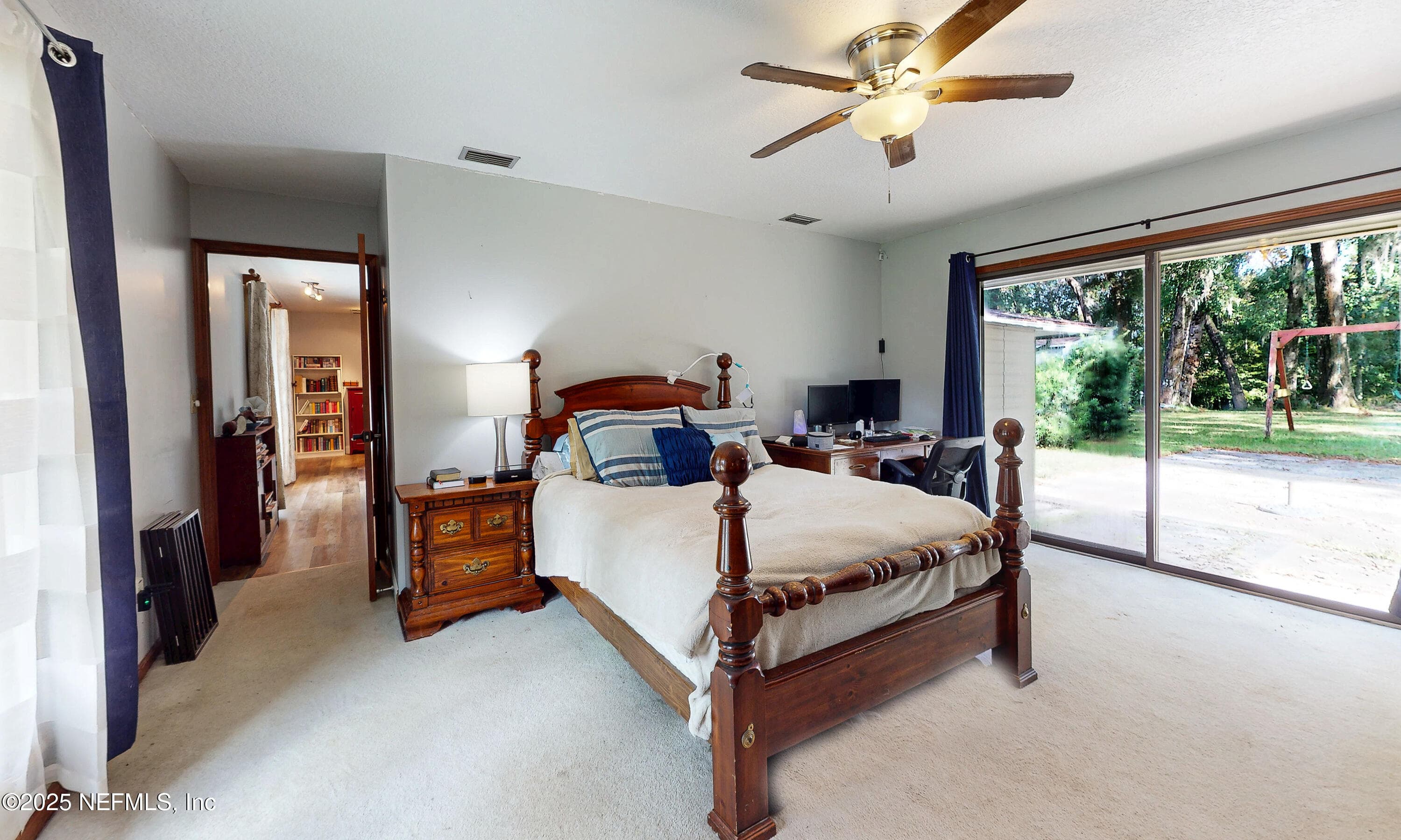 Bedroom 2 with private patio area — 2860 RAVINES Road, Middleburg, FL 32068