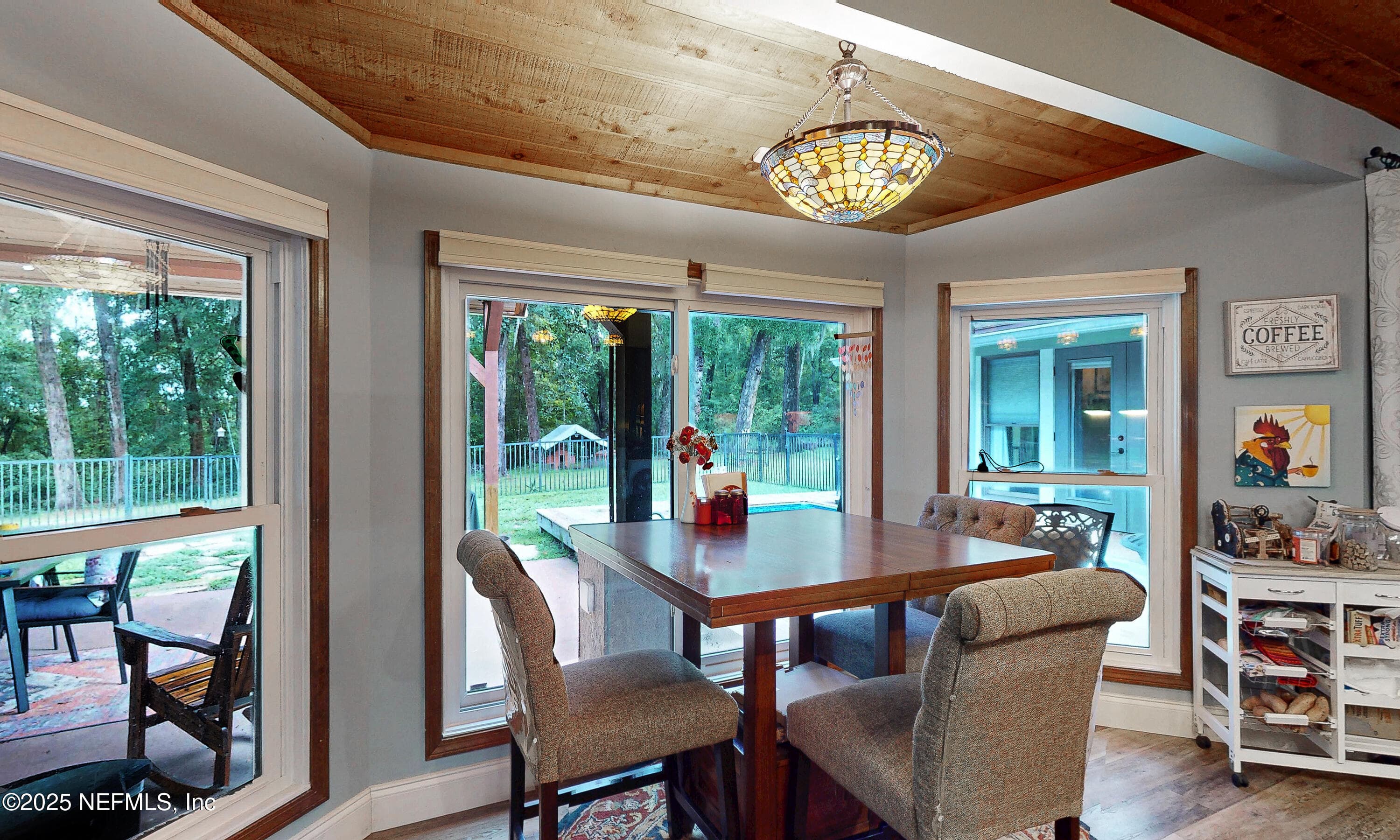 Eat-in breakfast nook overlooking the pool — 2860 RAVINES Road, Middleburg, FL 32068