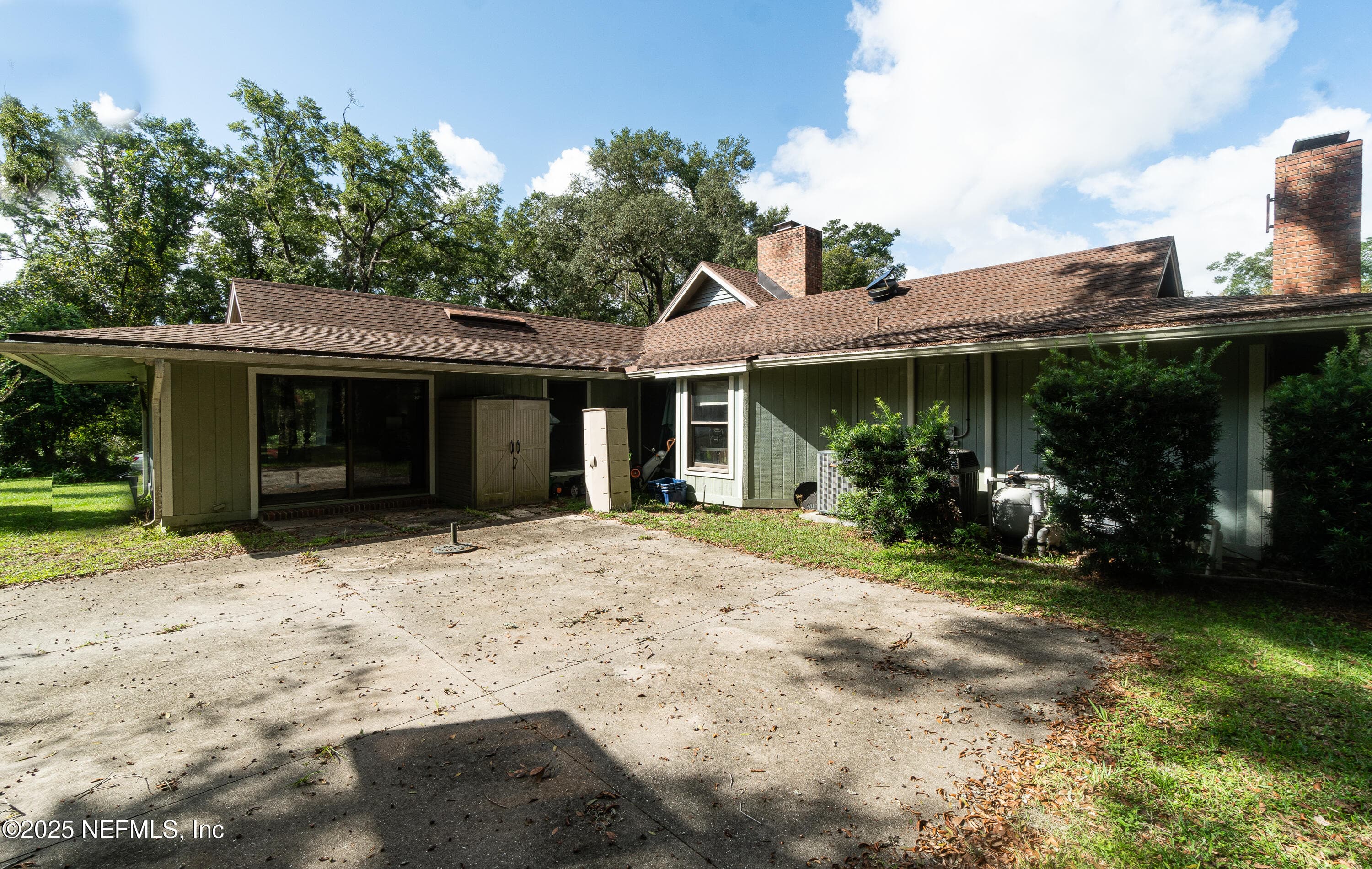 Flex patio and basketball court — 2860 RAVINES Road, Middleburg, FL 32068