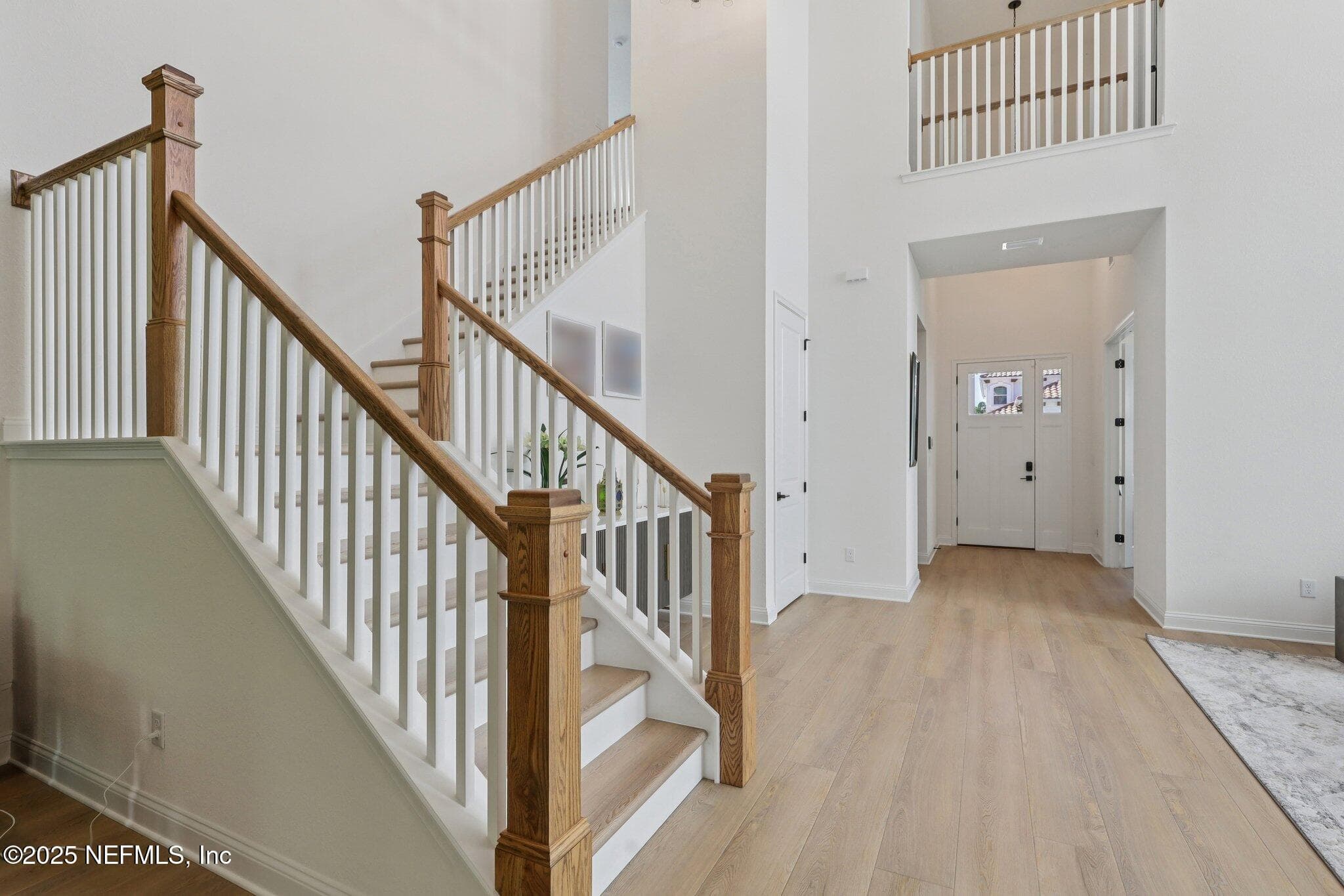 Beautiful wood staircase leading up to Bonus Room and 2 Bedrooms and 2 Full Baths — 3089 SPIRO Circle, Jacksonville, FL 32246