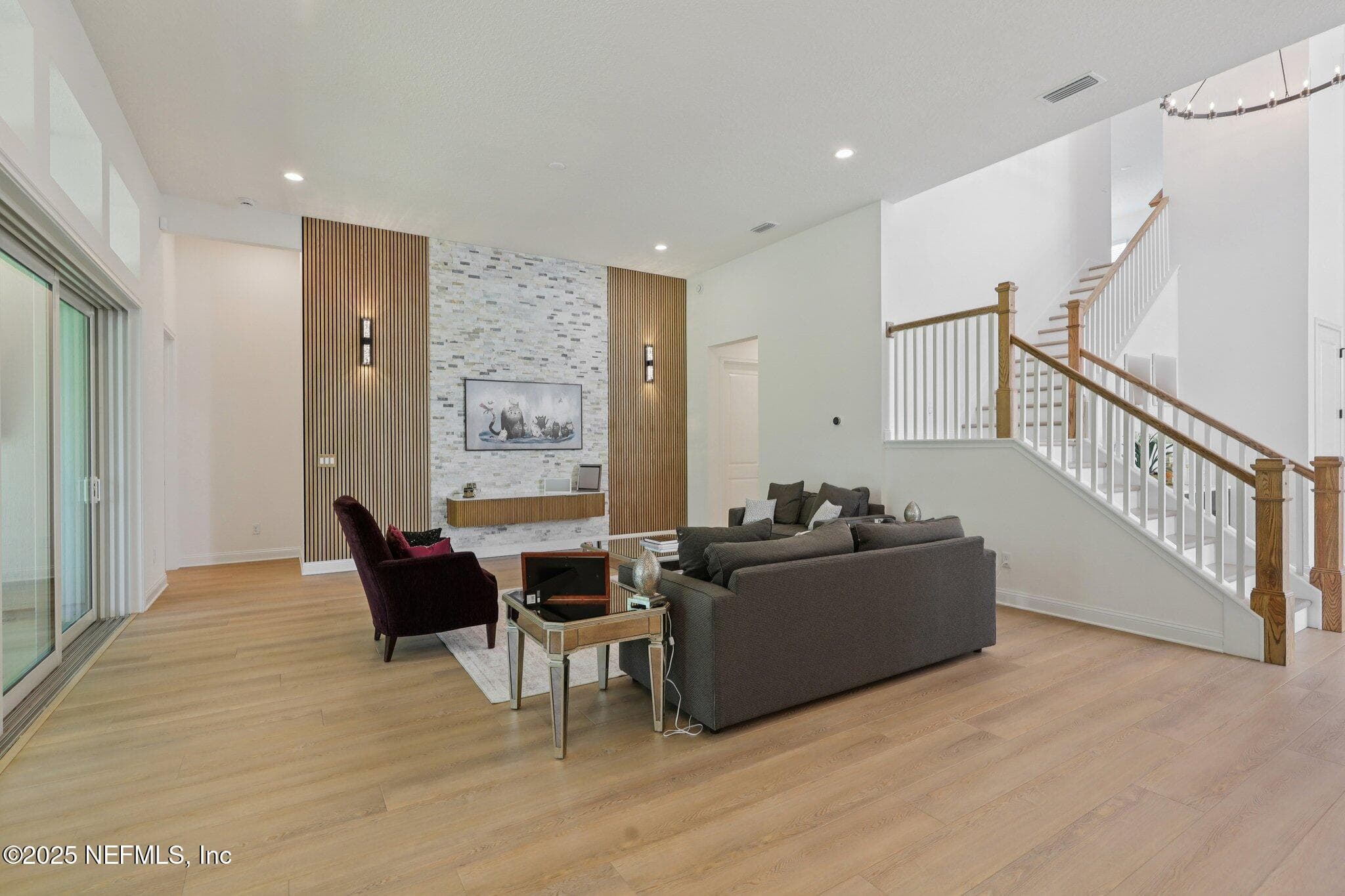 Family Room with the touch of modern design on the entertainment wall. — 3089 SPIRO Circle, Jacksonville, FL 32246