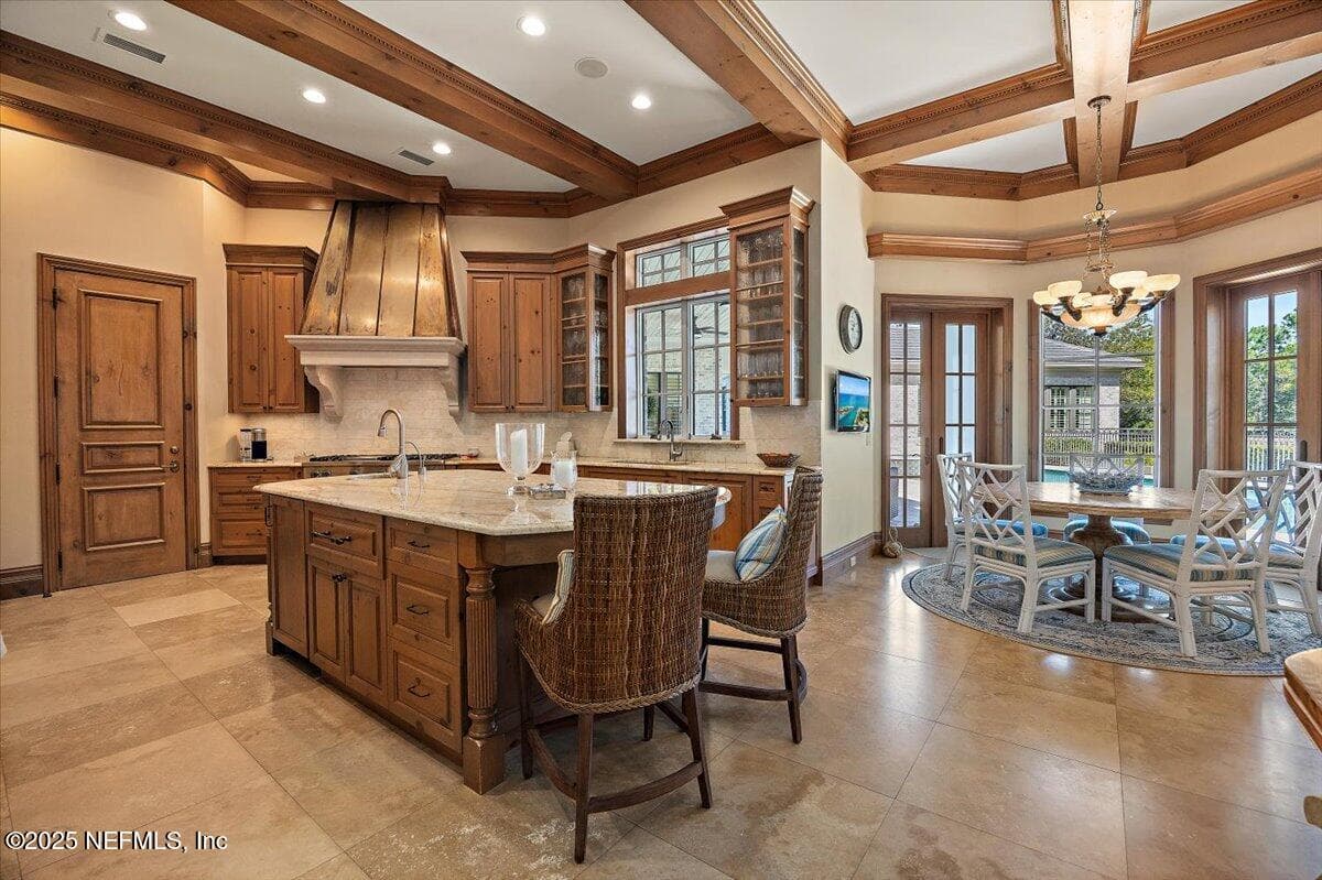 The island has a panel front warming drawer, ice maker, sink w/ disposal & water filtration. — 5367 CHANDLER BEND Drive, Jacksonville, FL 32224