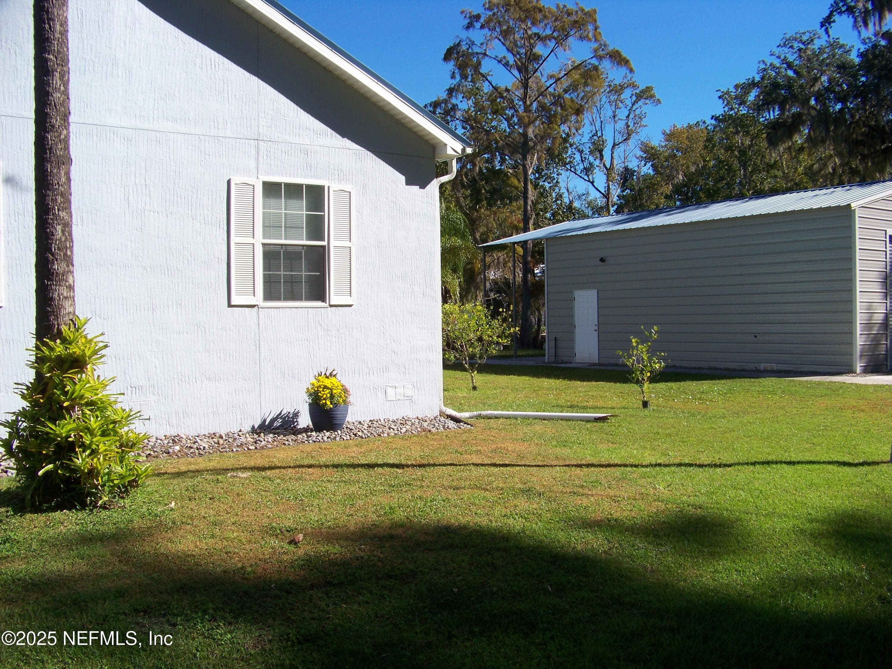 Garage built on extra lot, next to house — 118 HICKS Avenue, Crescent City, FL 32112