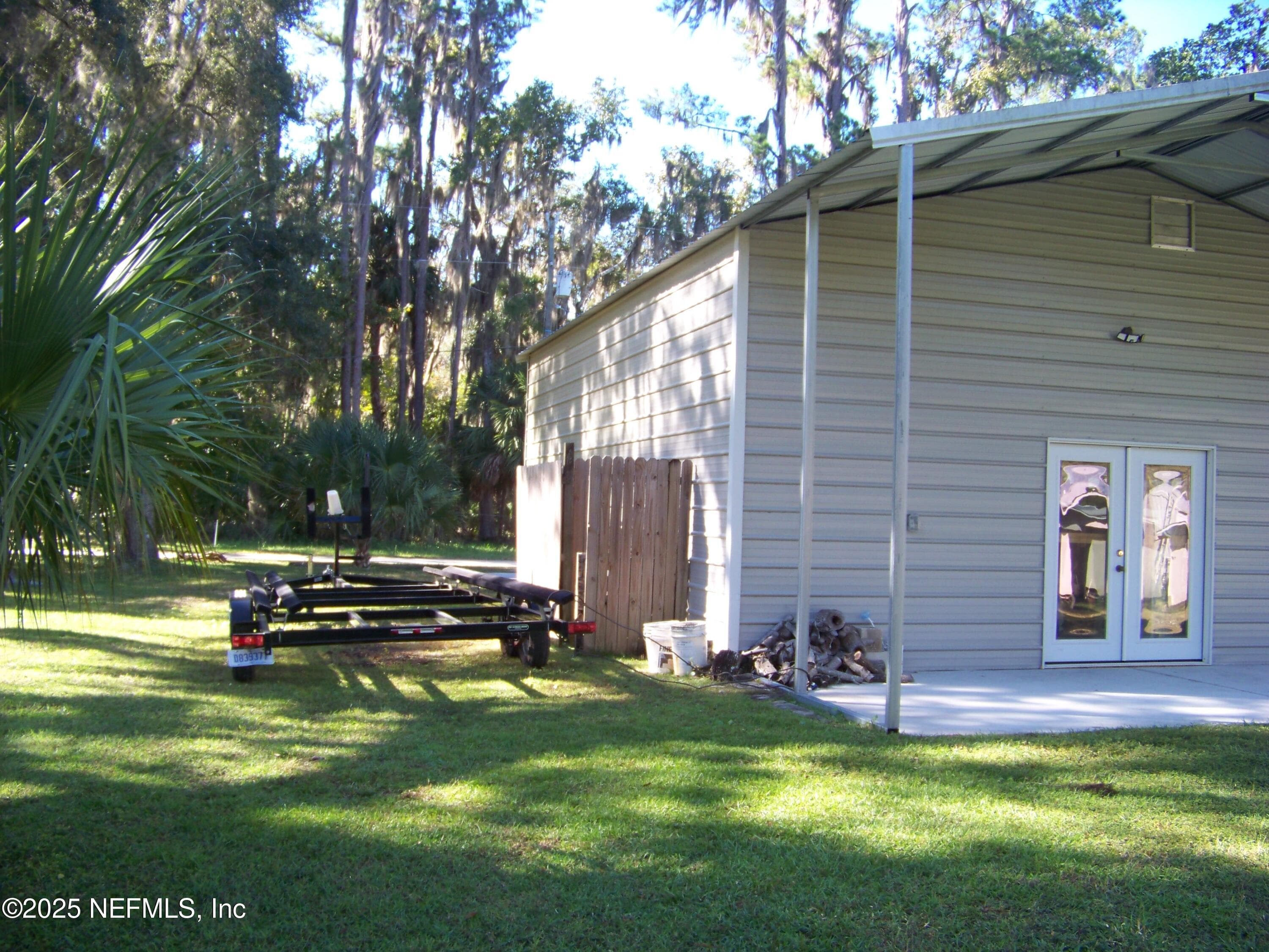 Boat trailer parking on side of garage — 118 HICKS Avenue, Crescent City, FL 32112