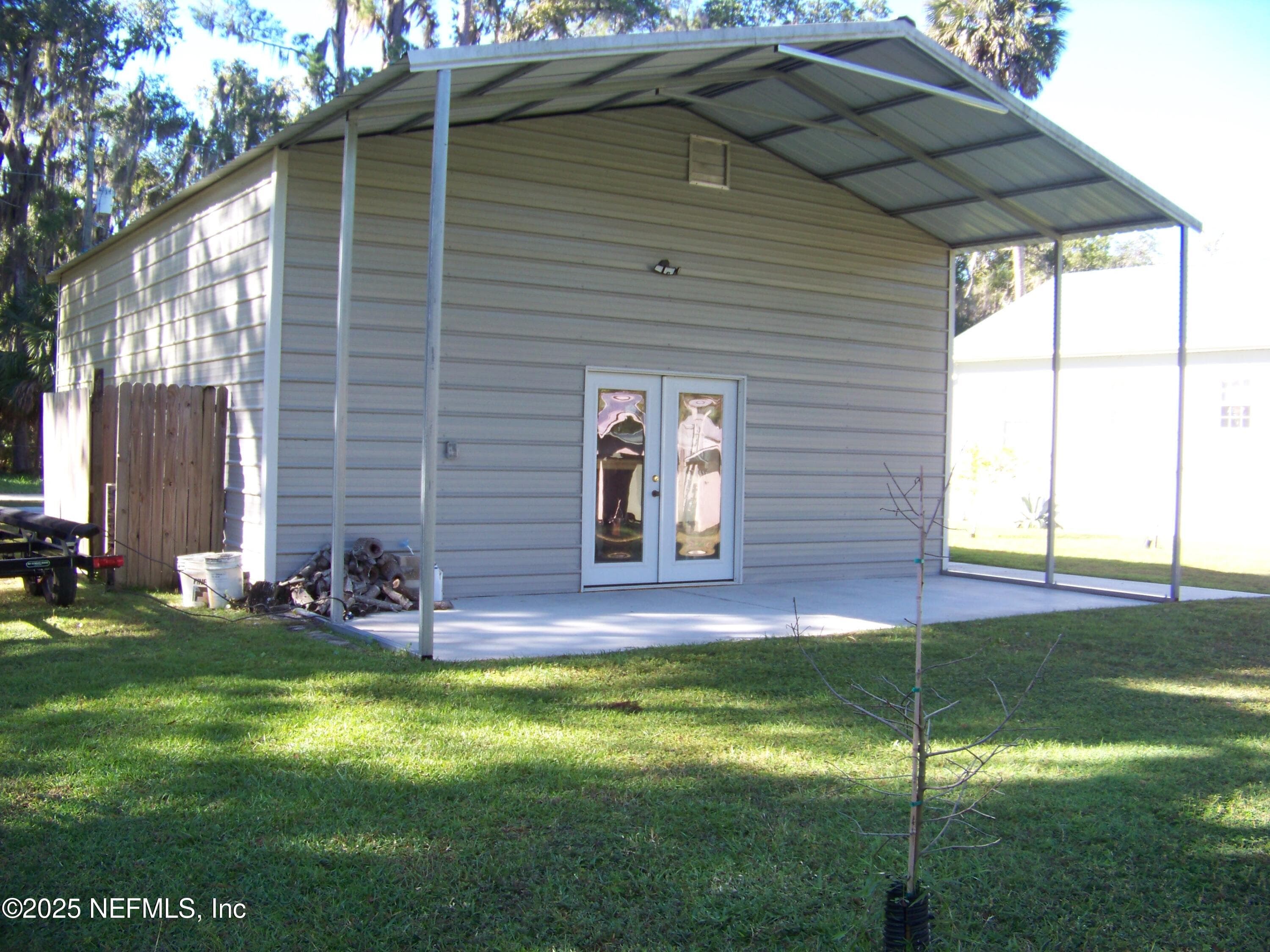 Garage has covered porch, waterside — 118 HICKS Avenue, Crescent City, FL 32112