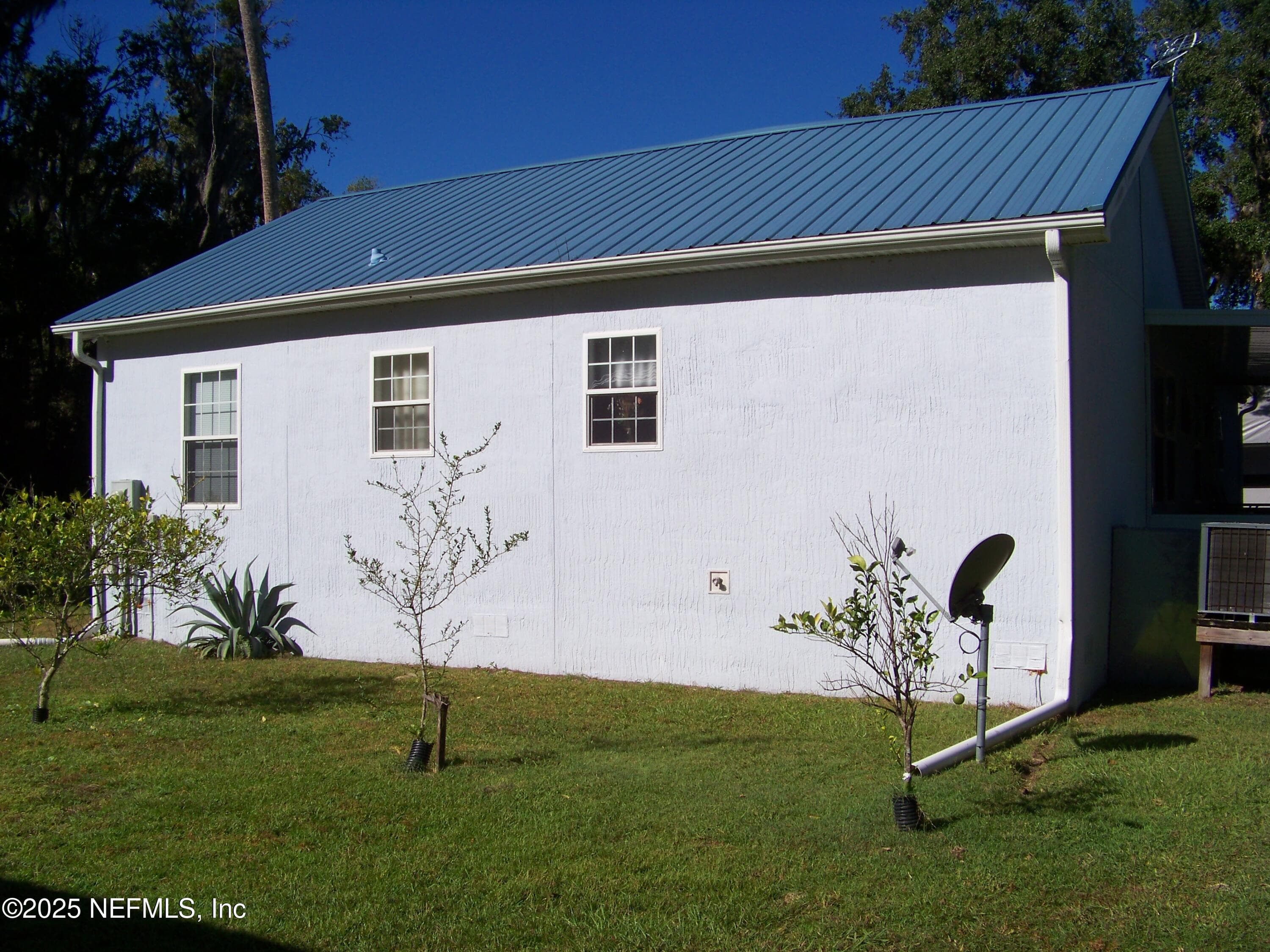 Eastside of the home — 118 HICKS Avenue, Crescent City, FL 32112