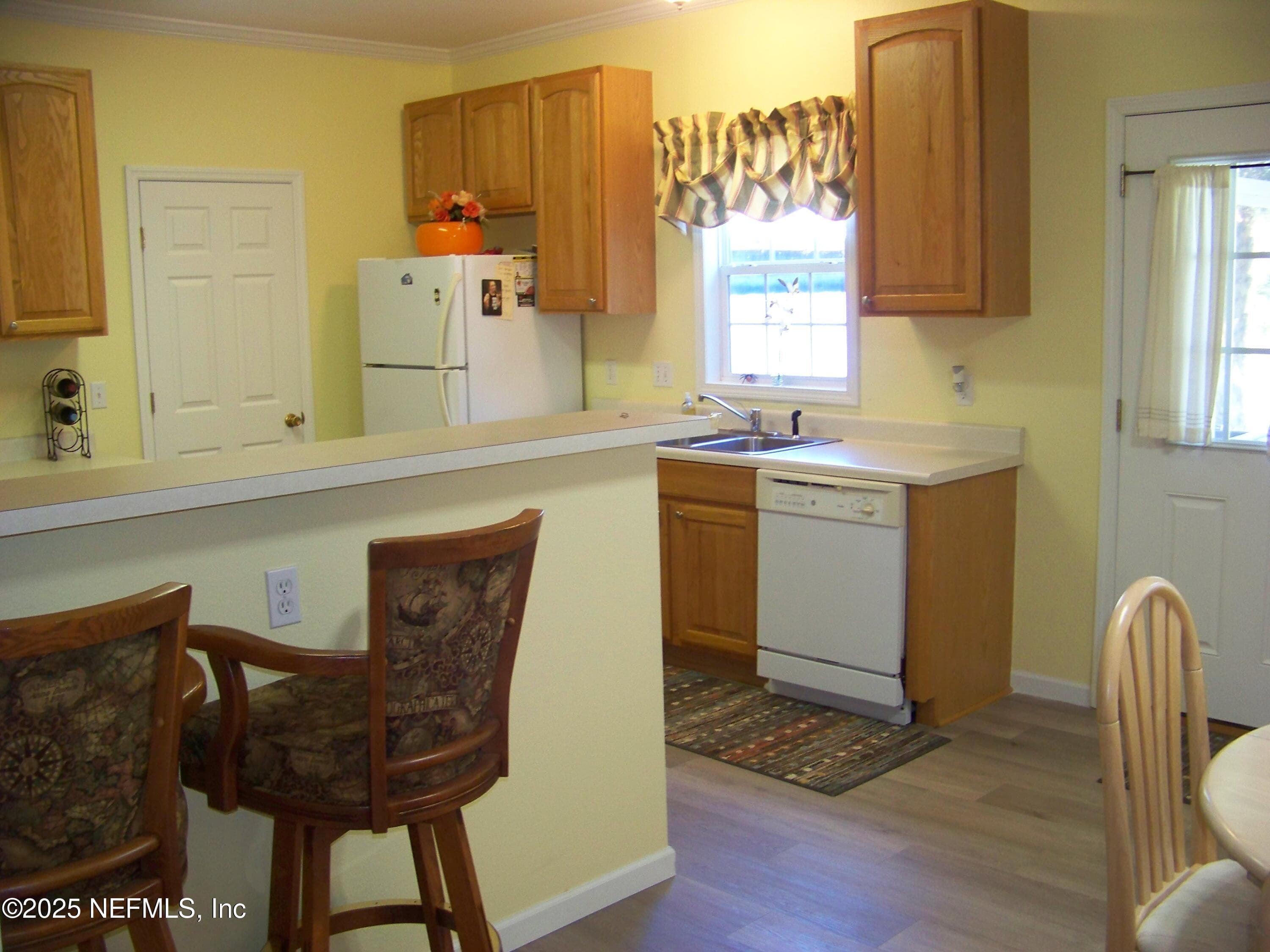 Kitchen with breakfast bar — 118 HICKS Avenue, Crescent City, FL 32112