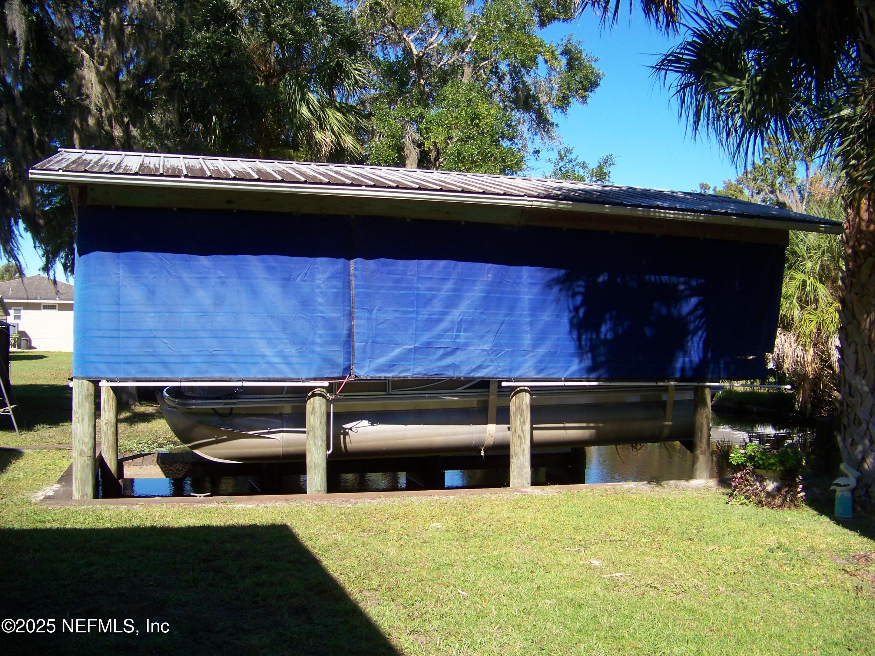Boathouse with lift — 118 HICKS Avenue, Crescent City, FL 32112