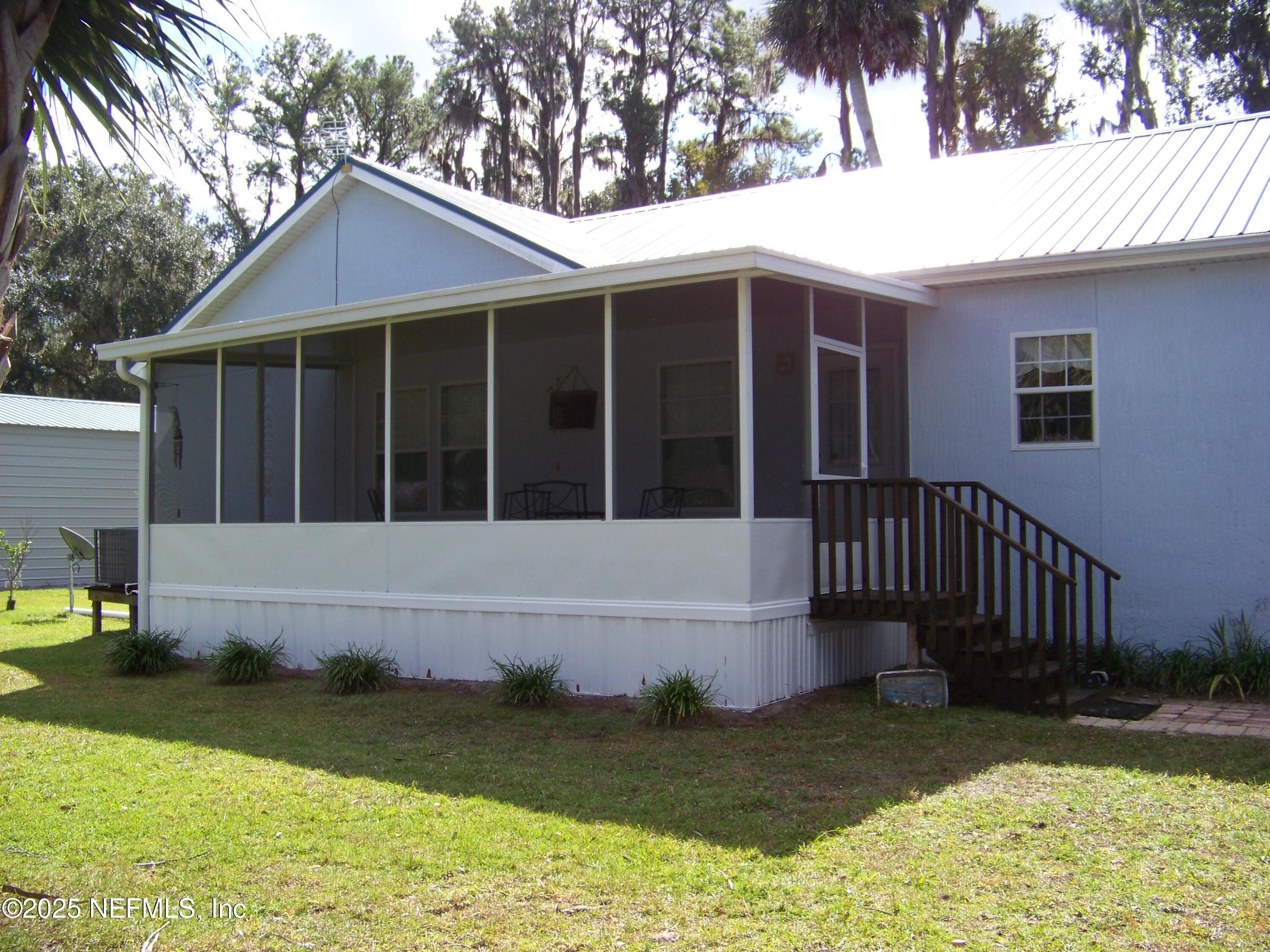View of screened porch from boathouse — 118 HICKS Avenue, Crescent City, FL 32112