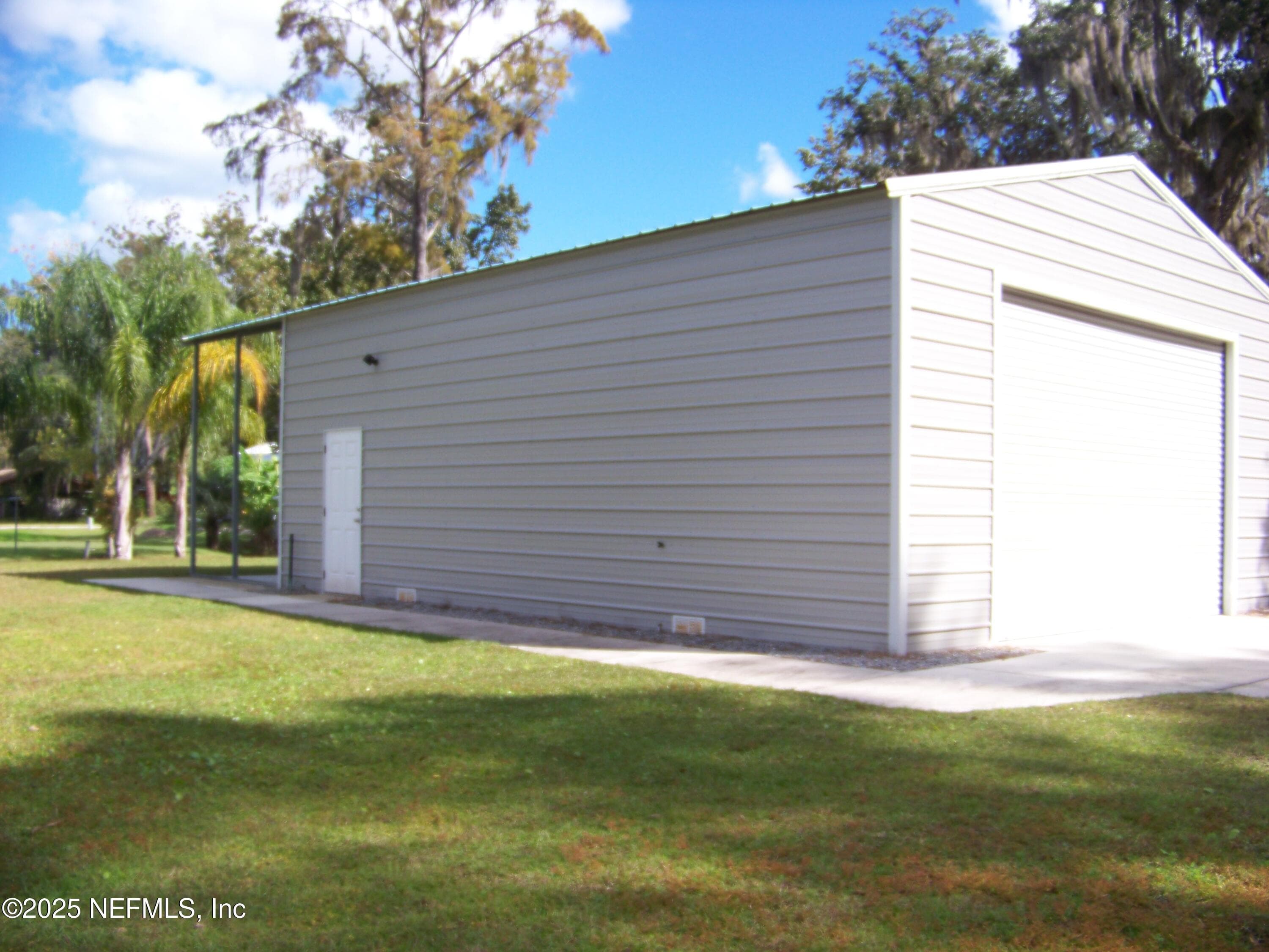 West side of garage — 118 HICKS Avenue, Crescent City, FL 32112