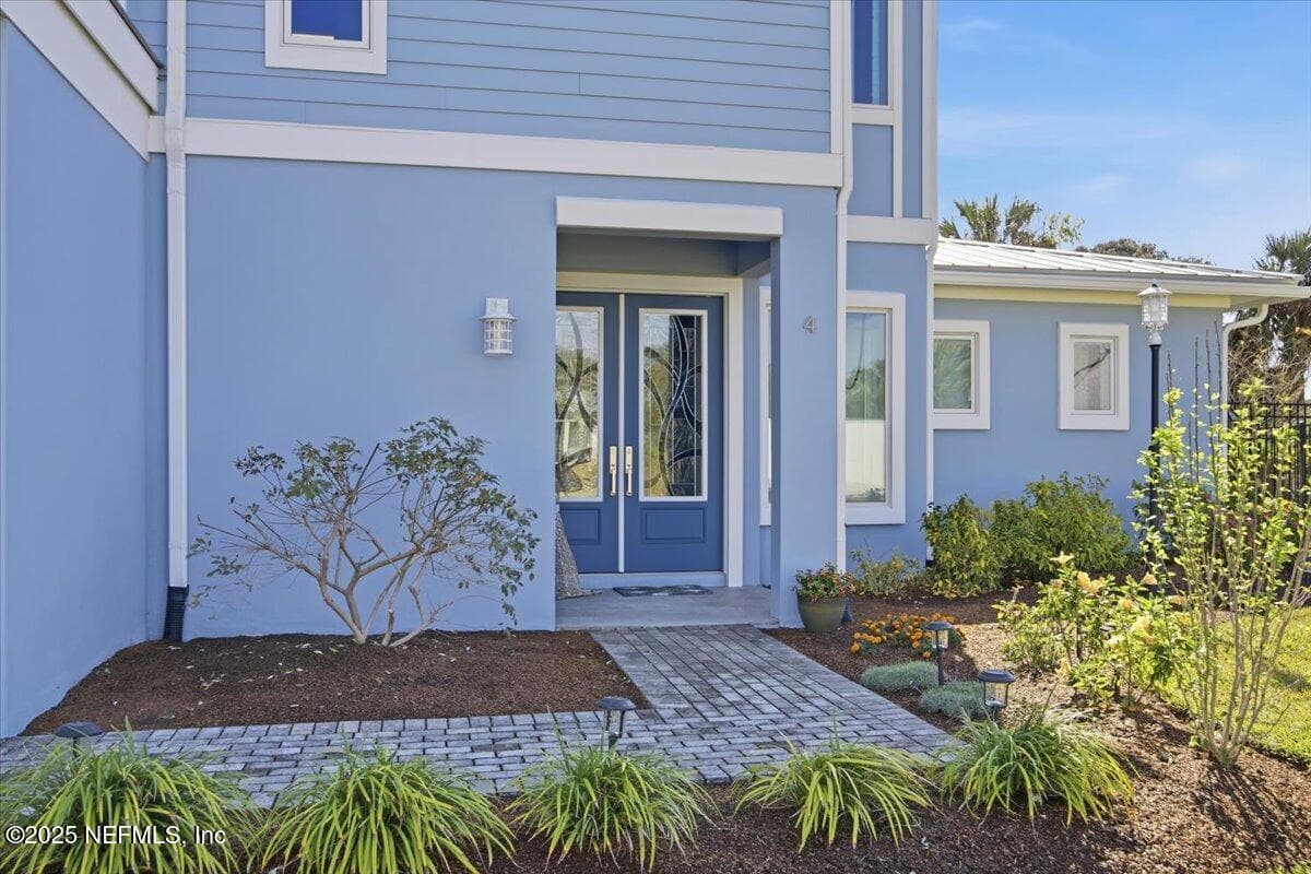 Heavy duty double doors from The Door Store in Tampa. Glass inserts with blue wave look. — 4 SUMMER Court, Jacksonville Beach, FL 32250