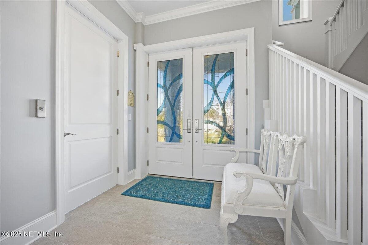 Doors are heavy (good seals) so have a special handle for pulling open. To your left is the elevator. And to your right the front stairs. — 4 SUMMER Court, Jacksonville Beach, FL 32250