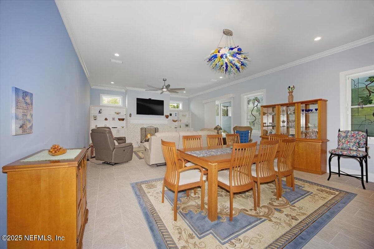 Dining room with Viz (Chahuly style) light over dining room table. — 4 SUMMER Court, Jacksonville Beach, FL 32250