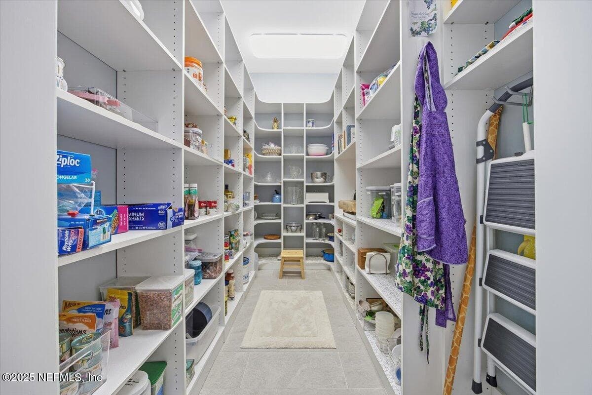 All these built in shelves! And even a spot for the ladder so you can reach everything. — 4 SUMMER Court, Jacksonville Beach, FL 32250