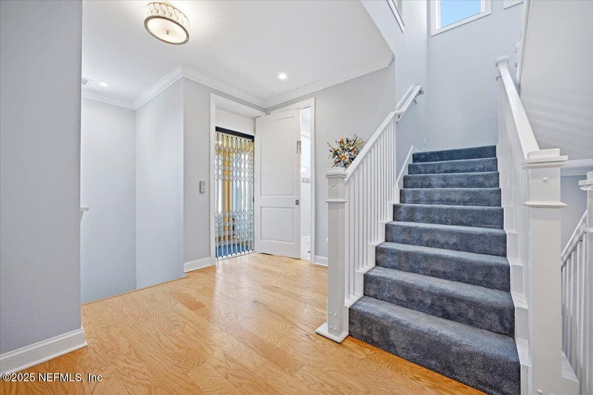 Back stairs to the left, elevator access there also, 2nd floor laundry, and front stairs. — 4 SUMMER Court, Jacksonville Beach, FL 32250