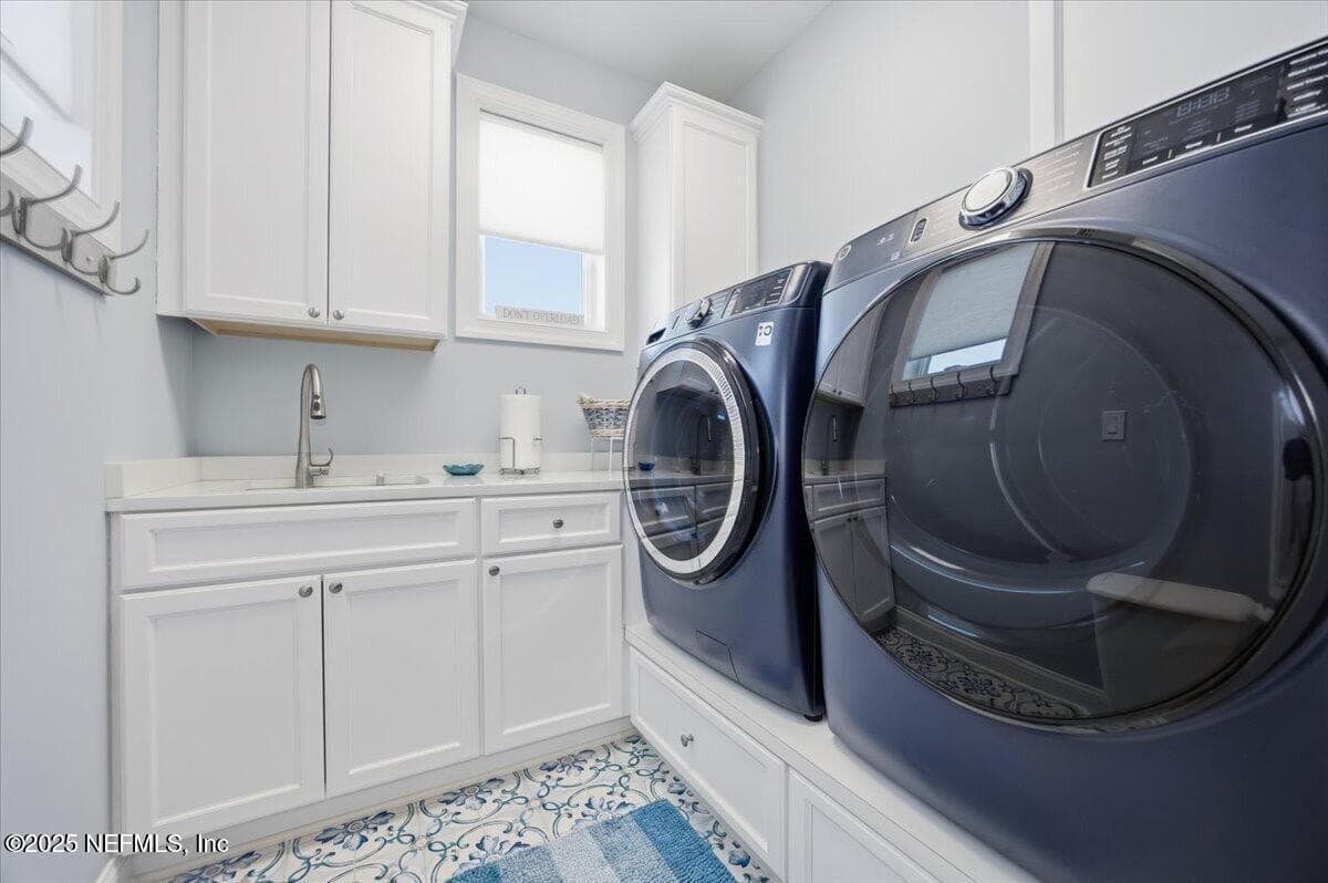 Custom made pedastal for washer and dryer. (plumbed for gas or electric for dryer.) TOP of the line tile in this room, and 2 windows for lots of sunlight. Utility sink comes in handy as well! — 4 SUMMER Court, Jacksonville Beach, FL 32250