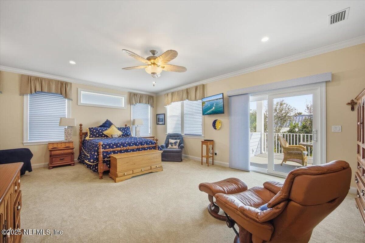 Roomy owners suite with sitting area and a private deck! Honeycone blinds on windows and on slider a beautiful easy to use blind. — 4 SUMMER Court, Jacksonville Beach, FL 32250