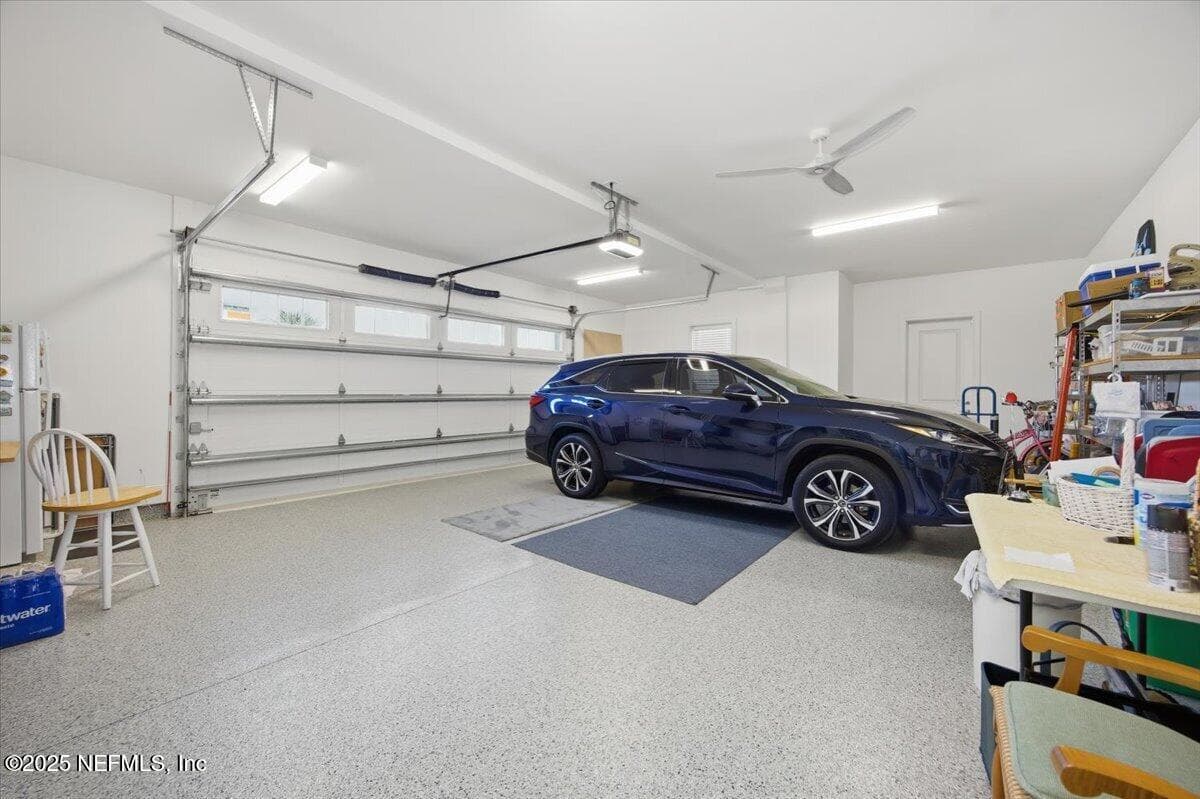 Garage is extra large on both sides and in the back. Lights and fans and that floor is epoxy and looks amazing. — 4 SUMMER Court, Jacksonville Beach, FL 32250