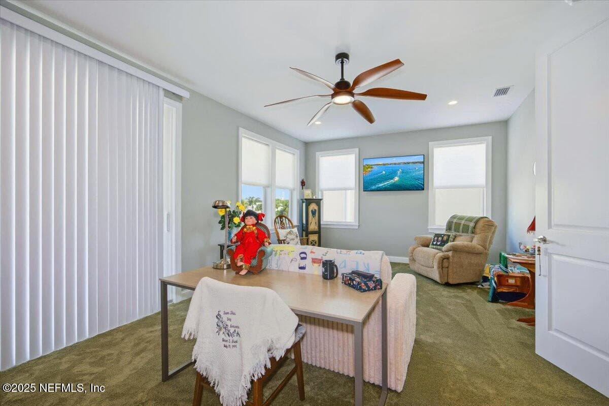 This picture does not show how large this bedroom truly is, and there are 4 windows and a HUGE sliding glass door to a long outside deck on the front of the home. — 4 SUMMER Court, Jacksonville Beach, FL 32250