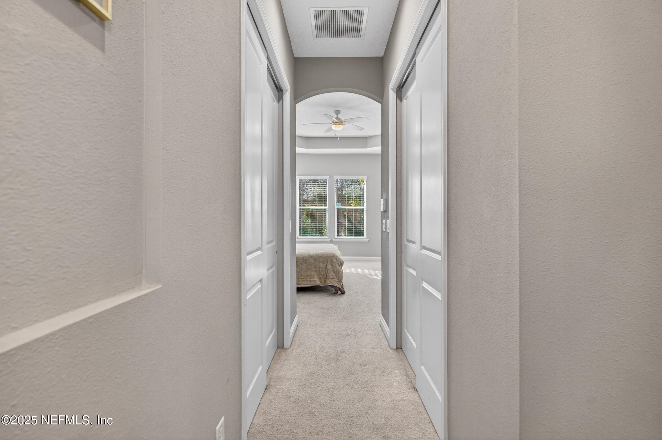 Entry way into the primary bedroom, dual closets on each side — 2752 TARTUS Drive, Jacksonville, FL 32246