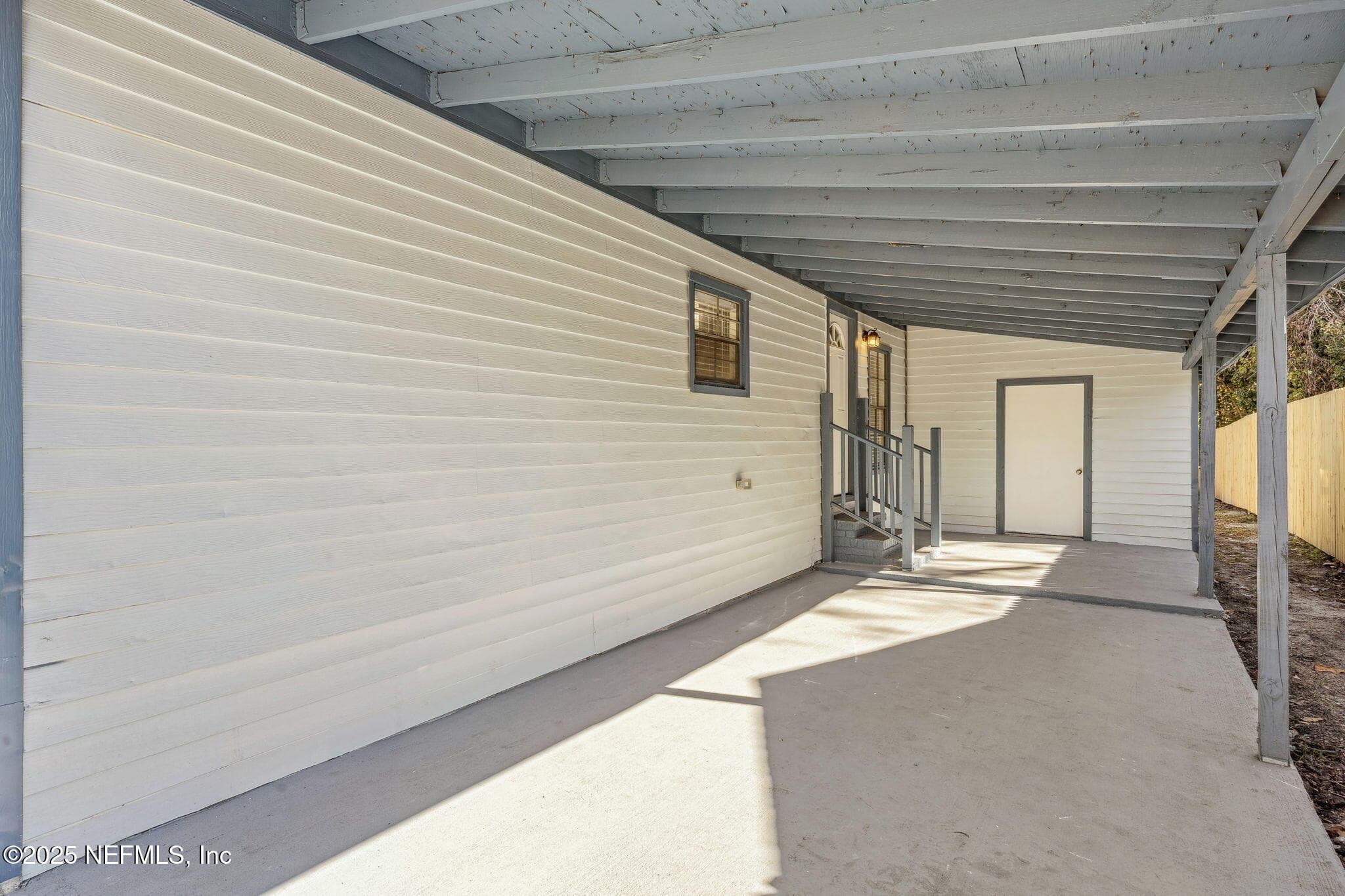 Single Car Carport with Large Laundry & Storage Capacity — 7611 MC COWAN Drive, Jacksonville, FL 32244