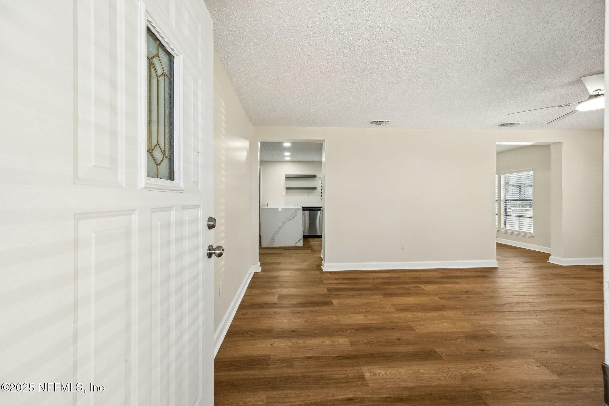 Home features beautiful lighting, ceiling fans with remotes, plenty of natural light! — 7611 MC COWAN Drive, Jacksonville, FL 32244