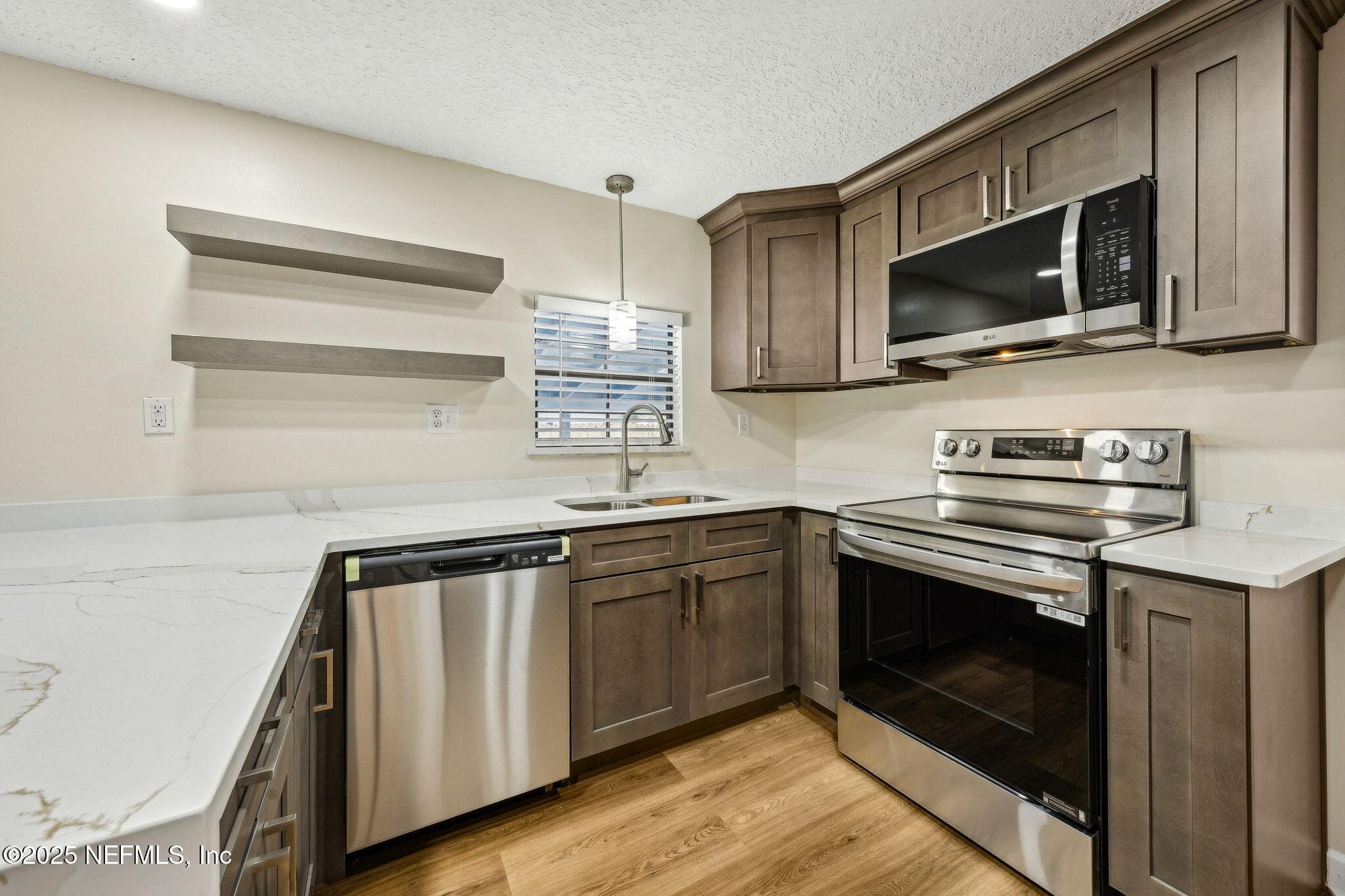 Completely Renovated Kitchen with beautiful kitchen cabinetry loaded with storage — 7611 MC COWAN Drive, Jacksonville, FL 32244