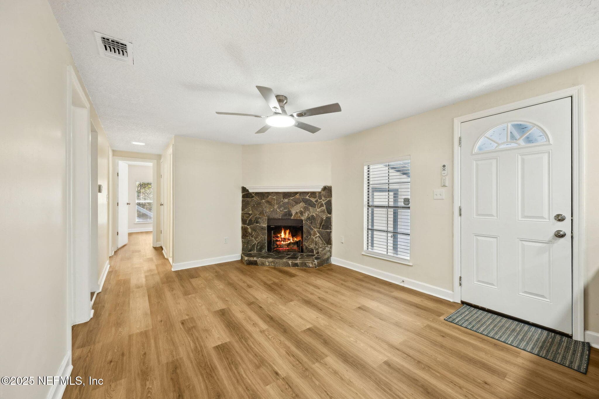 Family room Photo #2 shows access door to carport and laundry — 7611 MC COWAN Drive, Jacksonville, FL 32244