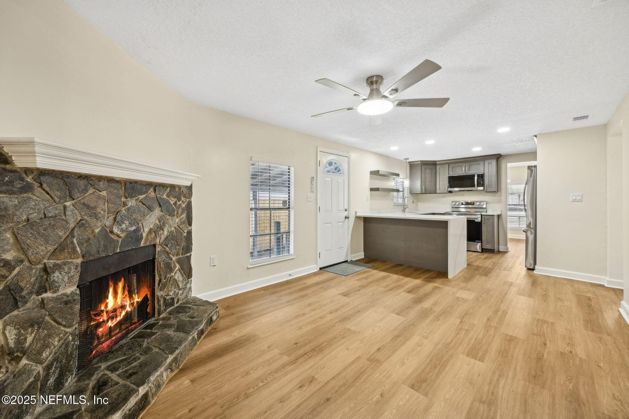 Family Room with Wood Burning Fireplace — 7611 MC COWAN Drive, Jacksonville, FL 32244