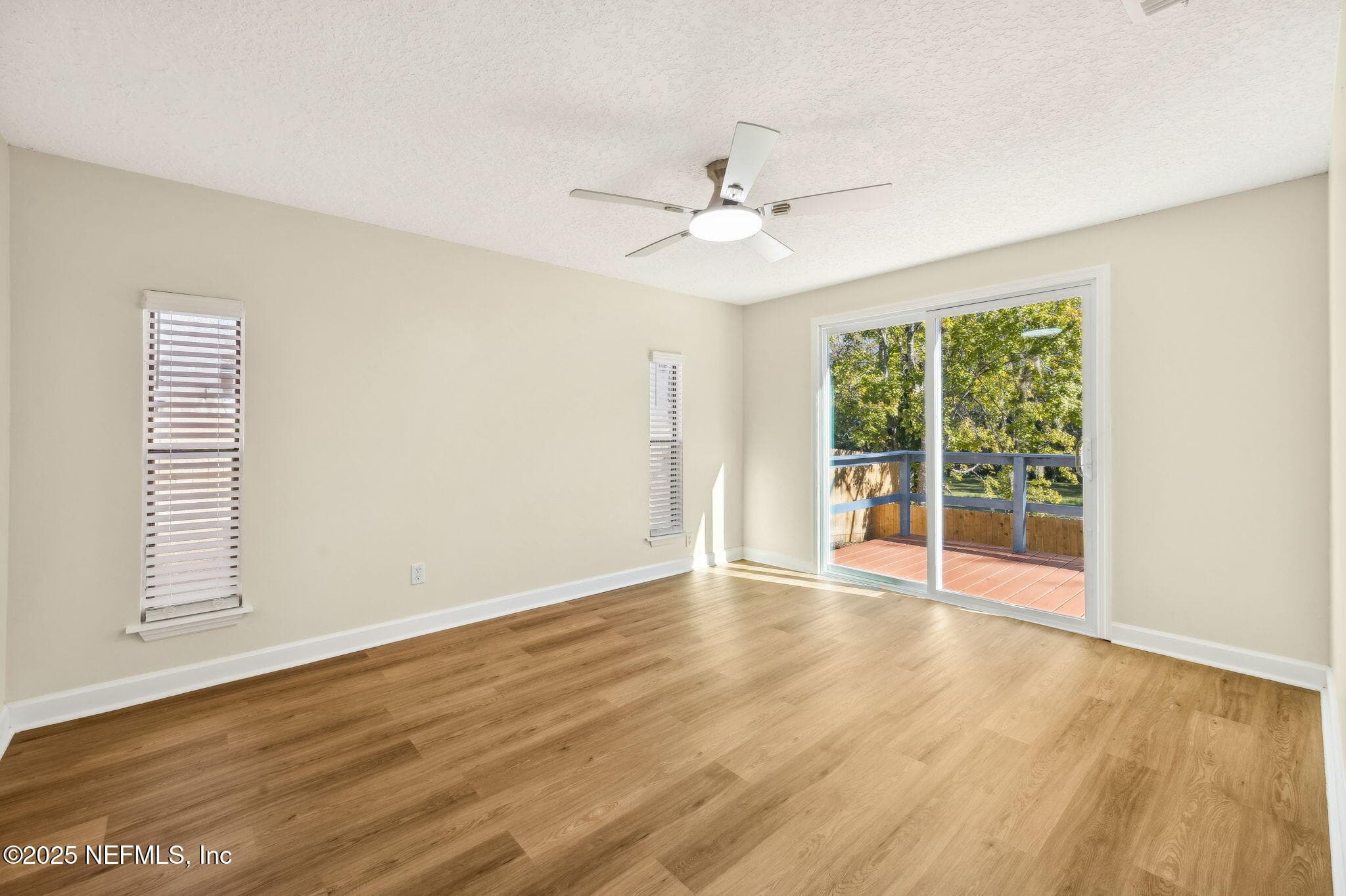 Spacious primary bedroom with
sliders to the back deck — 7611 MC COWAN Drive, Jacksonville, FL 32244