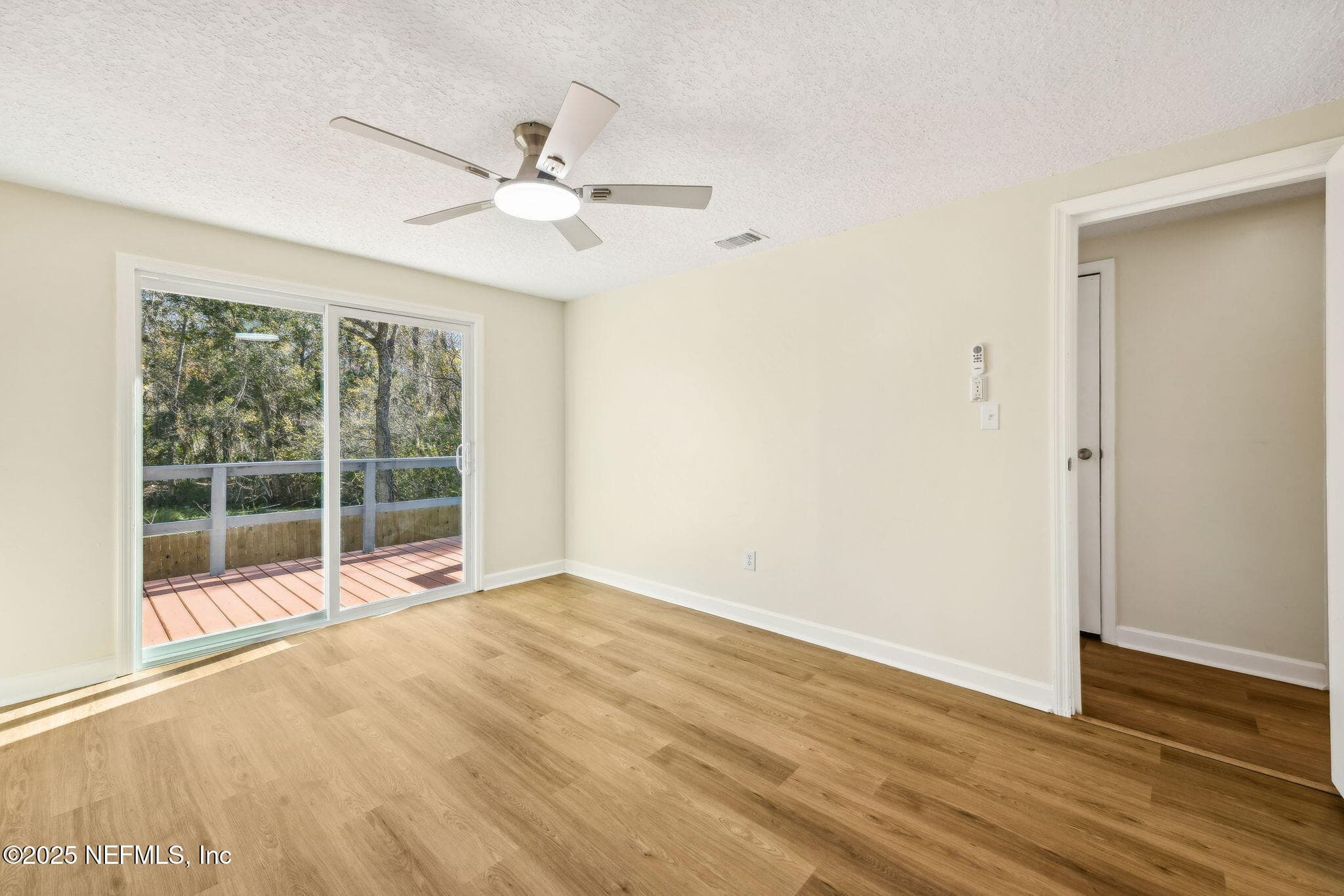 Primary bedroom Photo #3 new sliders to the open deck — 7611 MC COWAN Drive, Jacksonville, FL 32244