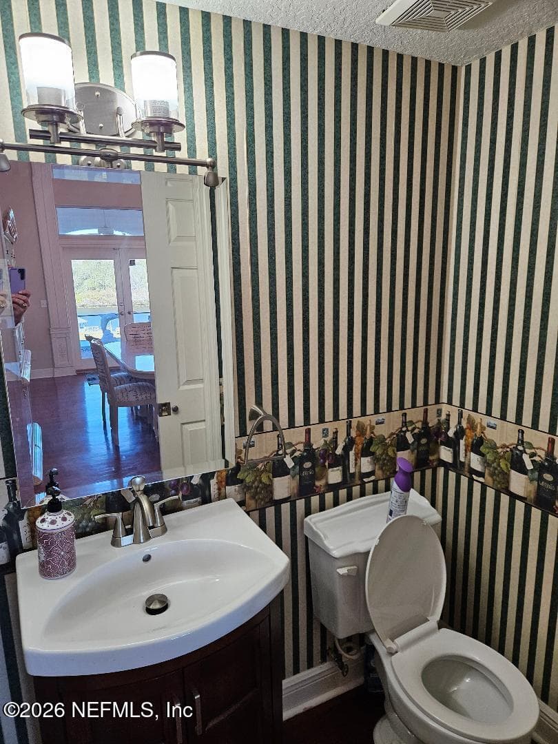 Half bath located off kitchen and family room - downstairs — 435 LAKE ASBURY Drive, Green Cove Springs, FL 32043