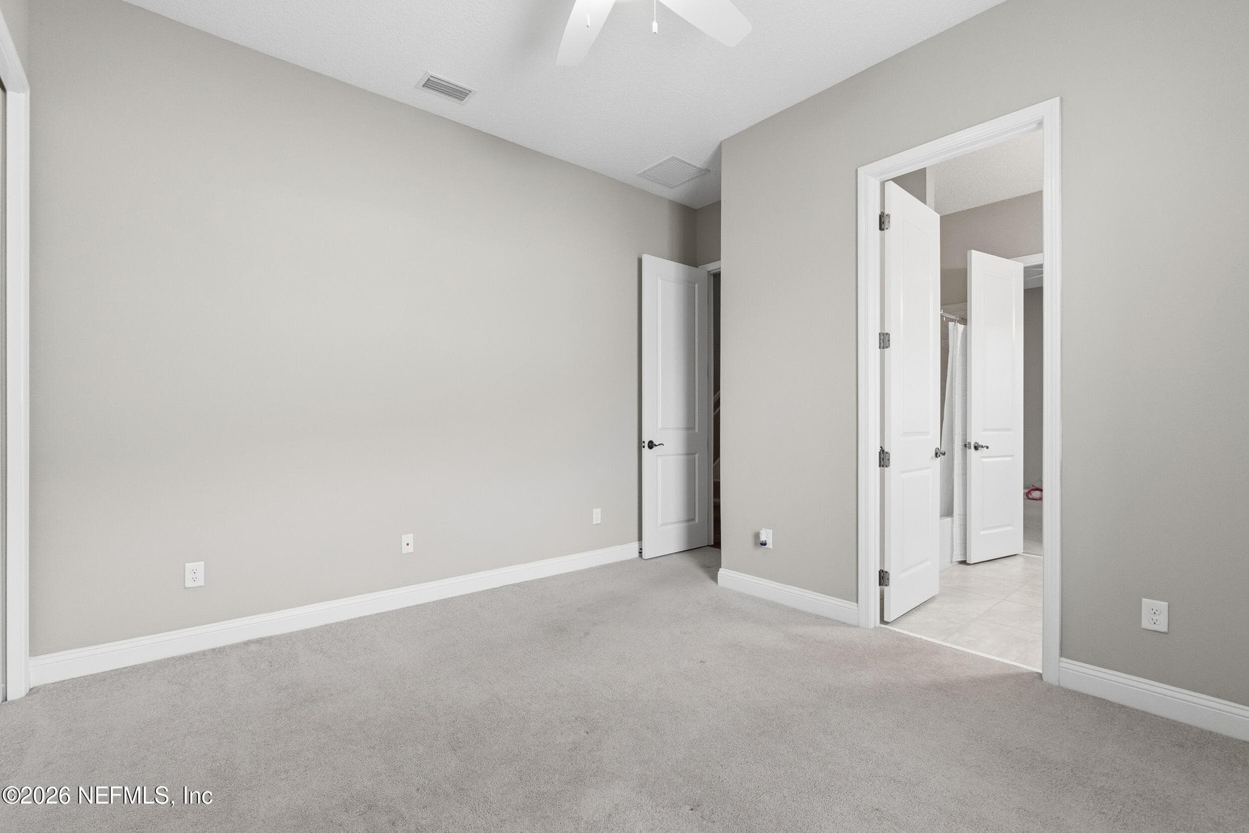 View into the bedroom door and Jack and Jill bathroom — 2752 TARTUS Drive, Jacksonville, FL 32246