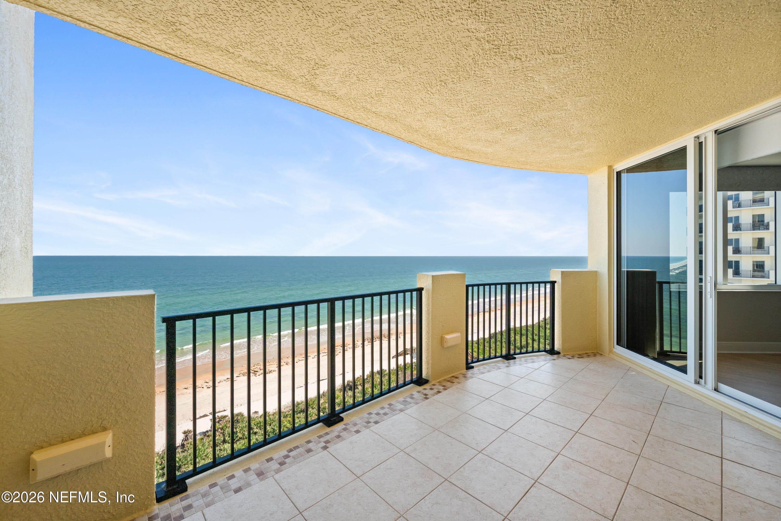 Balcony to entertaining space, dining room and primary bedroom — 19 AVENUE DE LA MER 705, Palm Coast, FL 32137