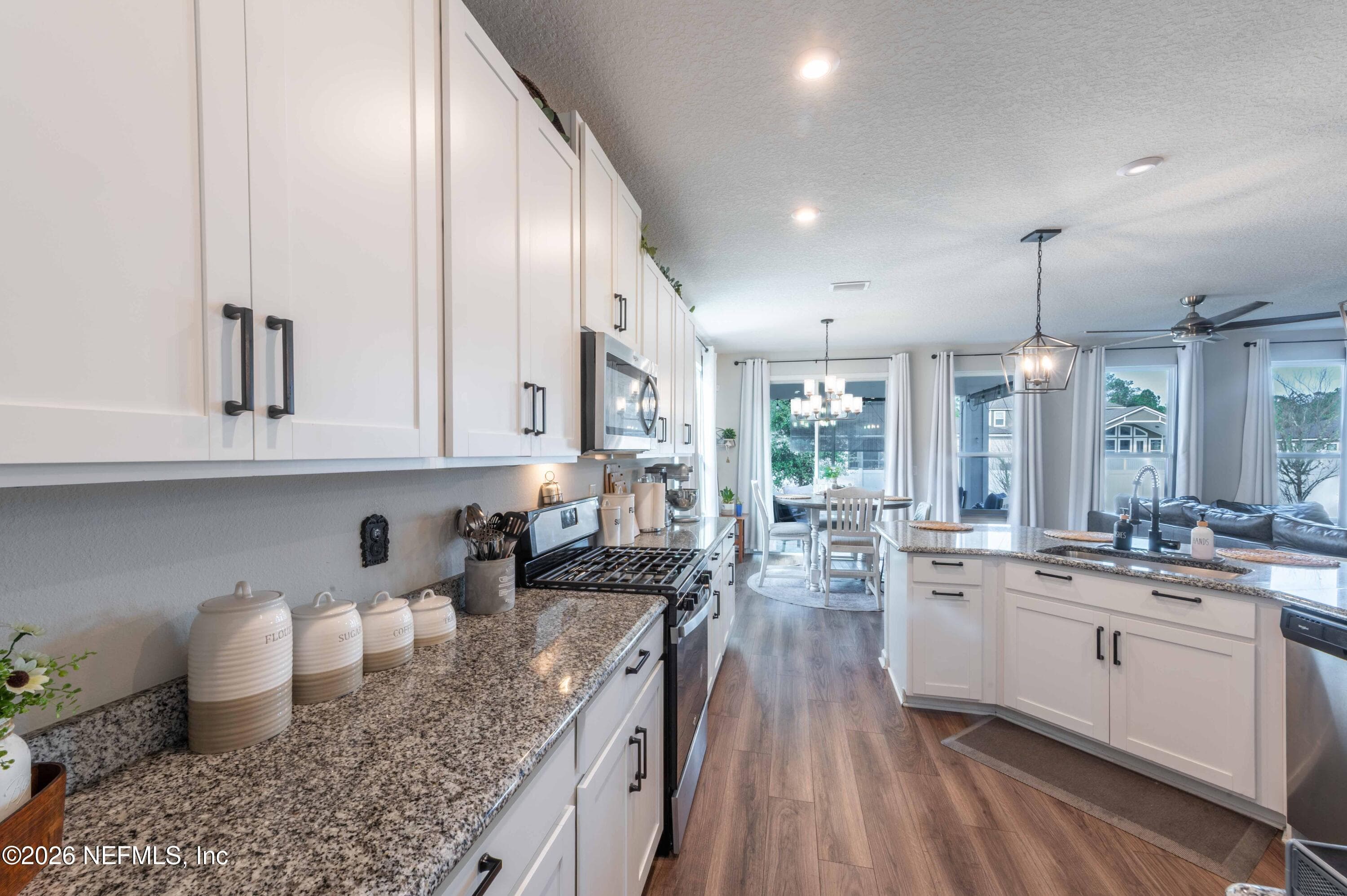 White shaker cabinets with Black Pull handles — 63 WINTERBERRY Court, St. Johns, FL 32259