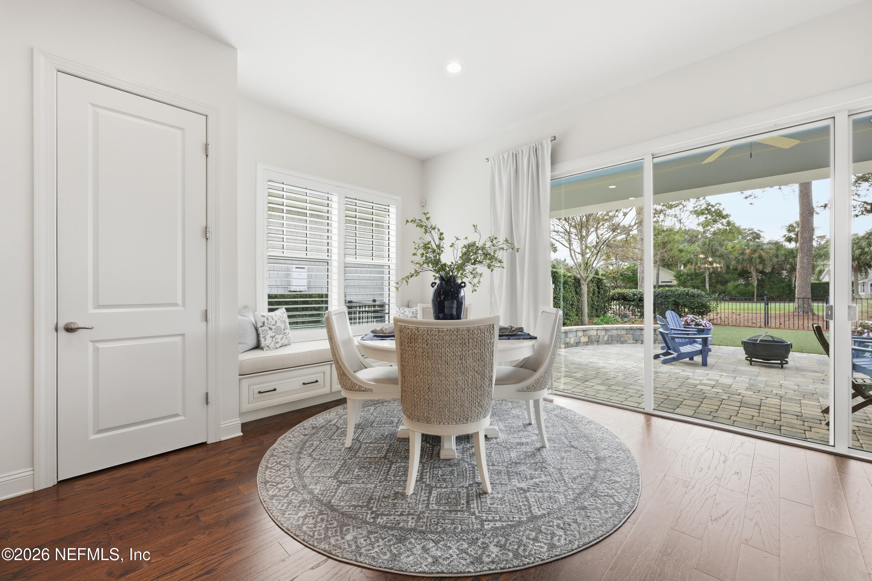 Breakfast nook with round table and large windows overlooking the backyard. — 568 TIMBER BRIDGE Lane, Atlantic Beach, FL 32233