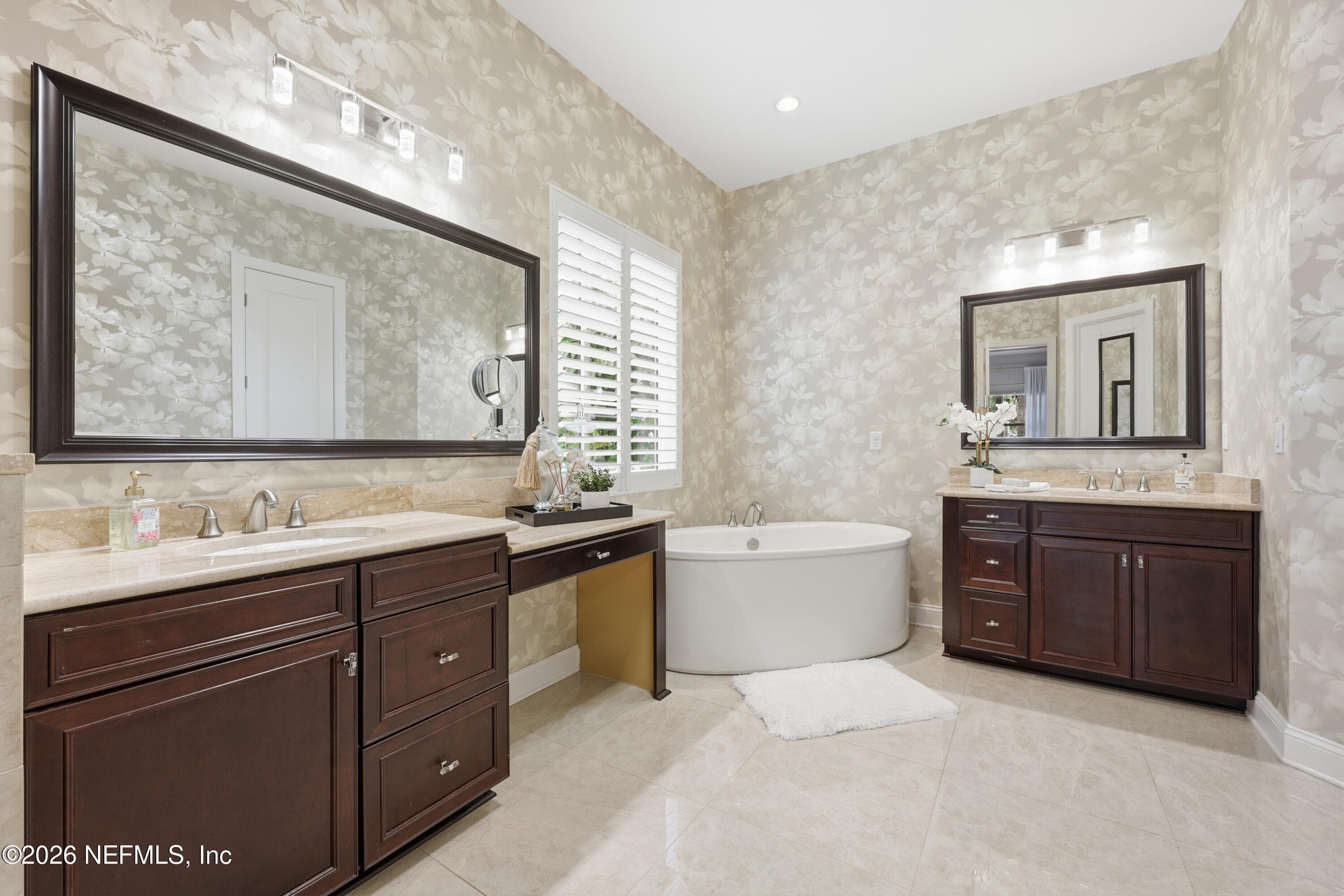 Primary bathroom with dual vanity, freestanding tub, and glass-enclosed shower. — 568 TIMBER BRIDGE Lane, Atlantic Beach, FL 32233