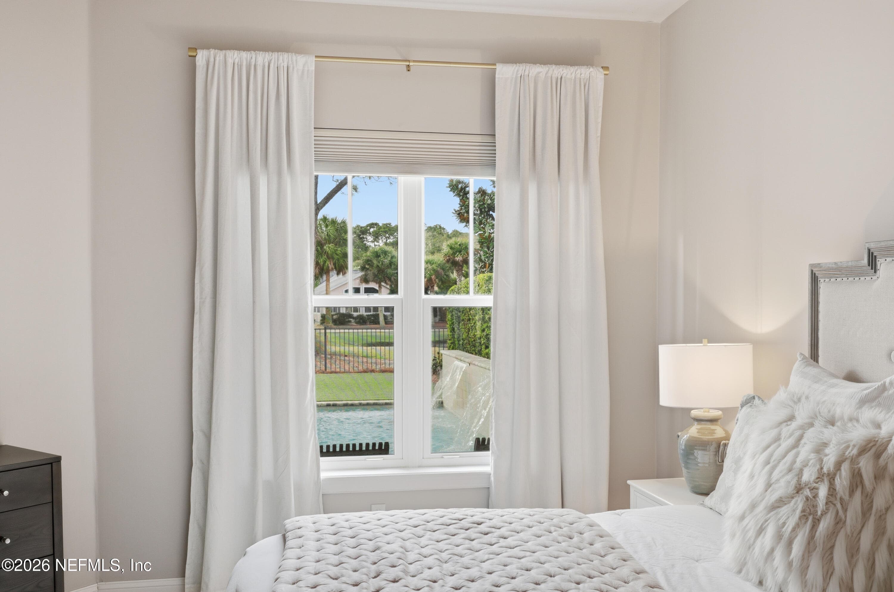 Bedroom with large window, neutral finishes, and natural light. — 568 TIMBER BRIDGE Lane, Atlantic Beach, FL 32233