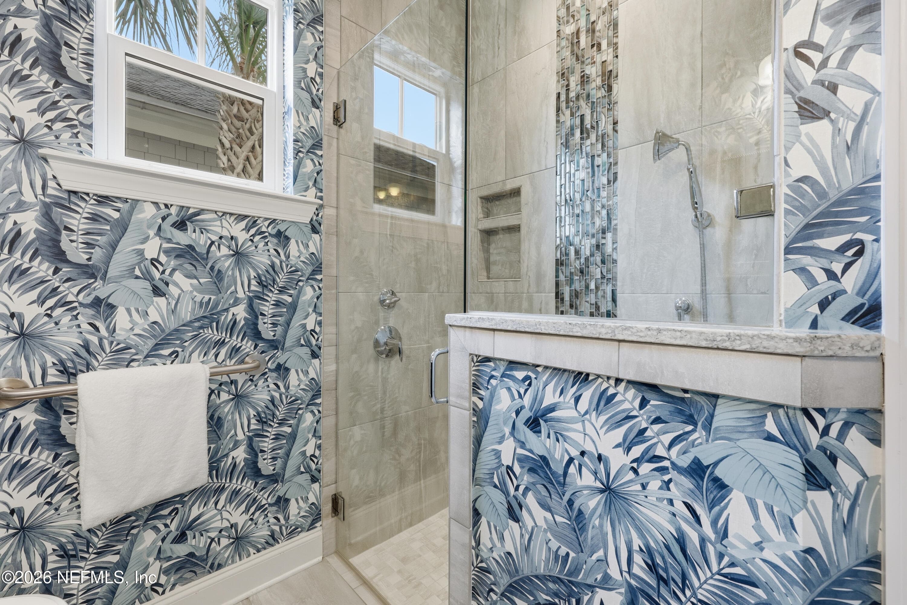 First-floor glass-enclosed shower with gorgeous blue patterned wall finish and bright tile surround. — 568 TIMBER BRIDGE Lane, Atlantic Beach, FL 32233