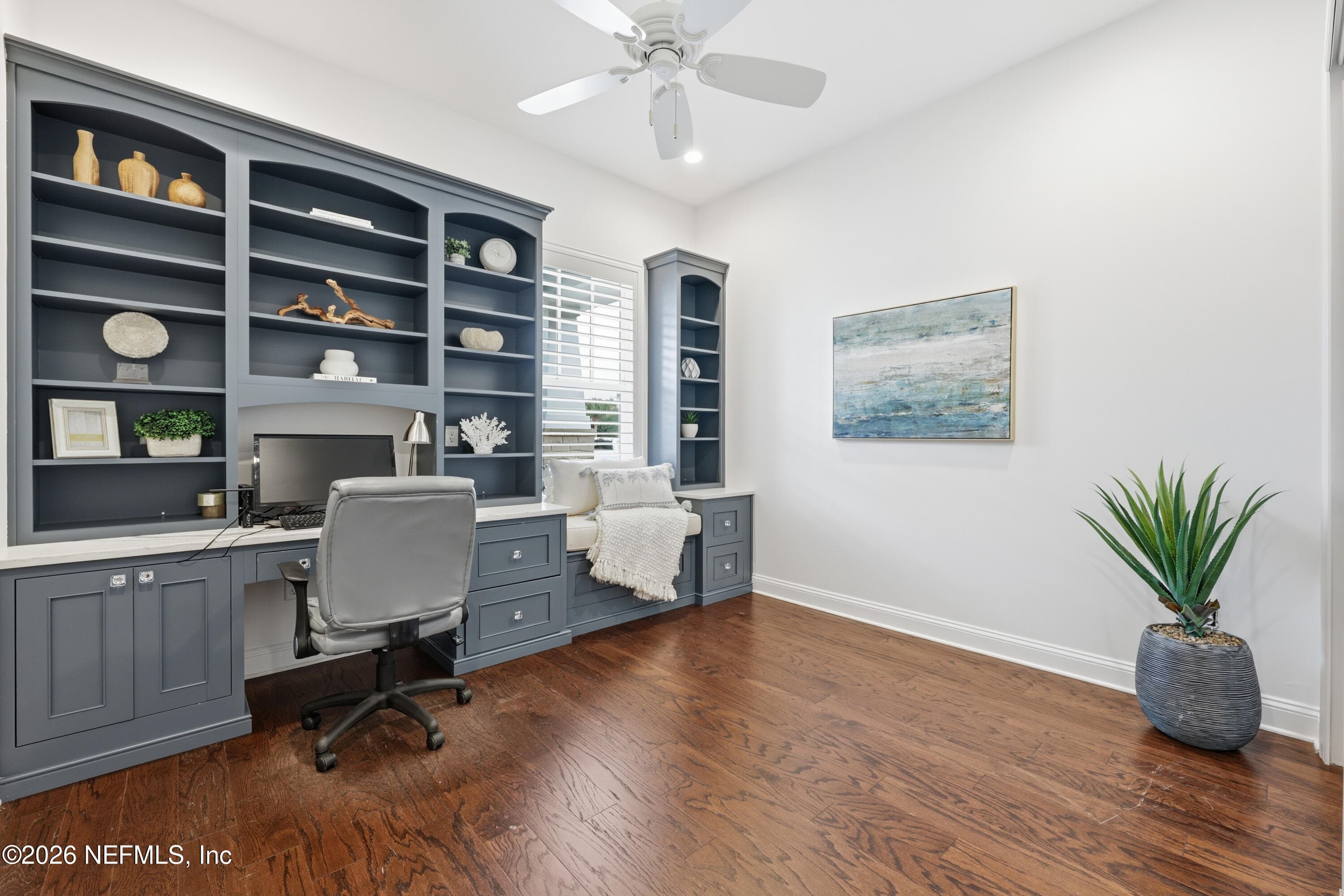 First-floor office with custom built-in shelving and cabinetry over hardwood floors. — 568 TIMBER BRIDGE Lane, Atlantic Beach, FL 32233