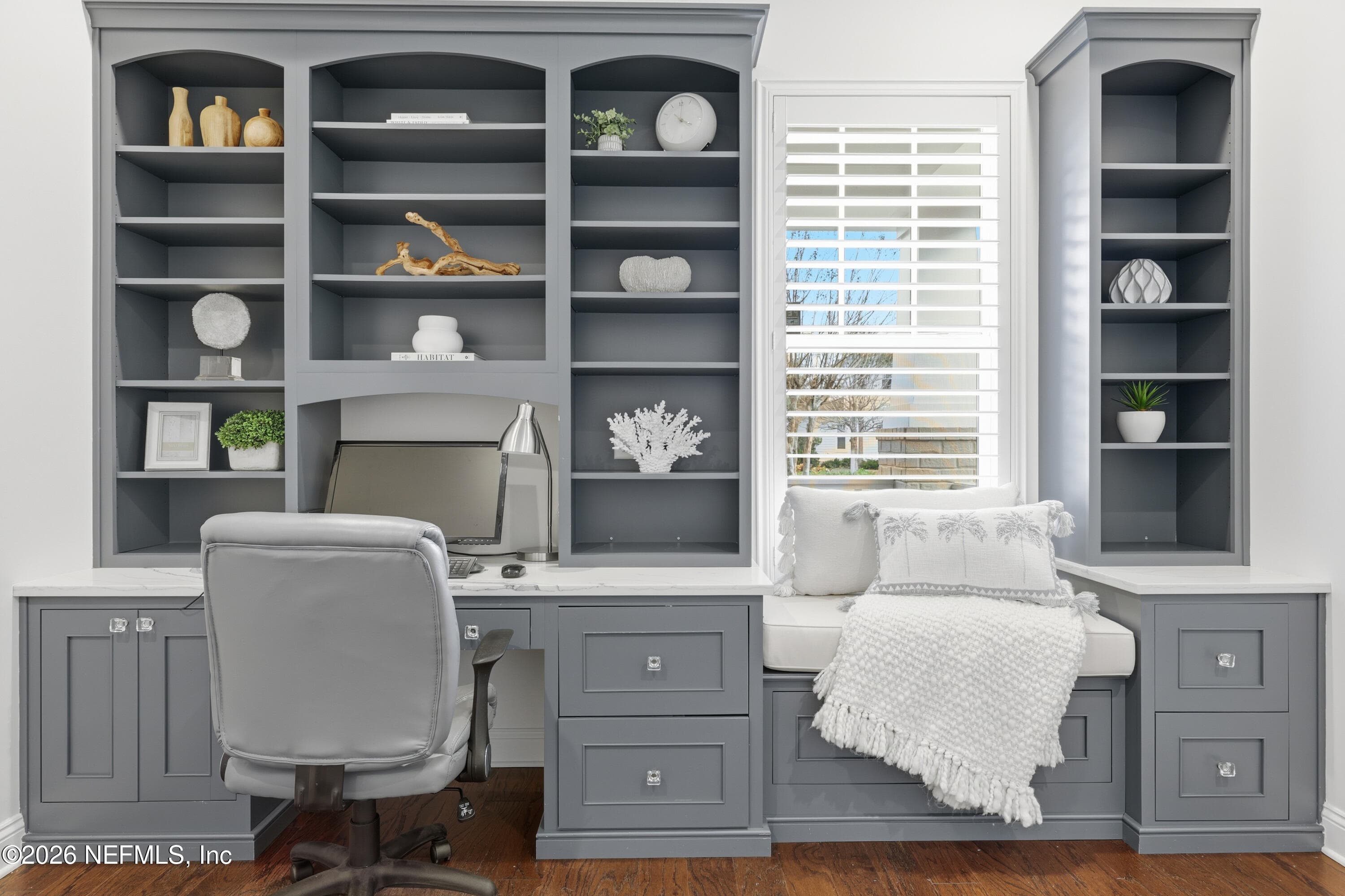 Built-in office wall with shelving and cabinetry providing storage and workspace. — 568 TIMBER BRIDGE Lane, Atlantic Beach, FL 32233